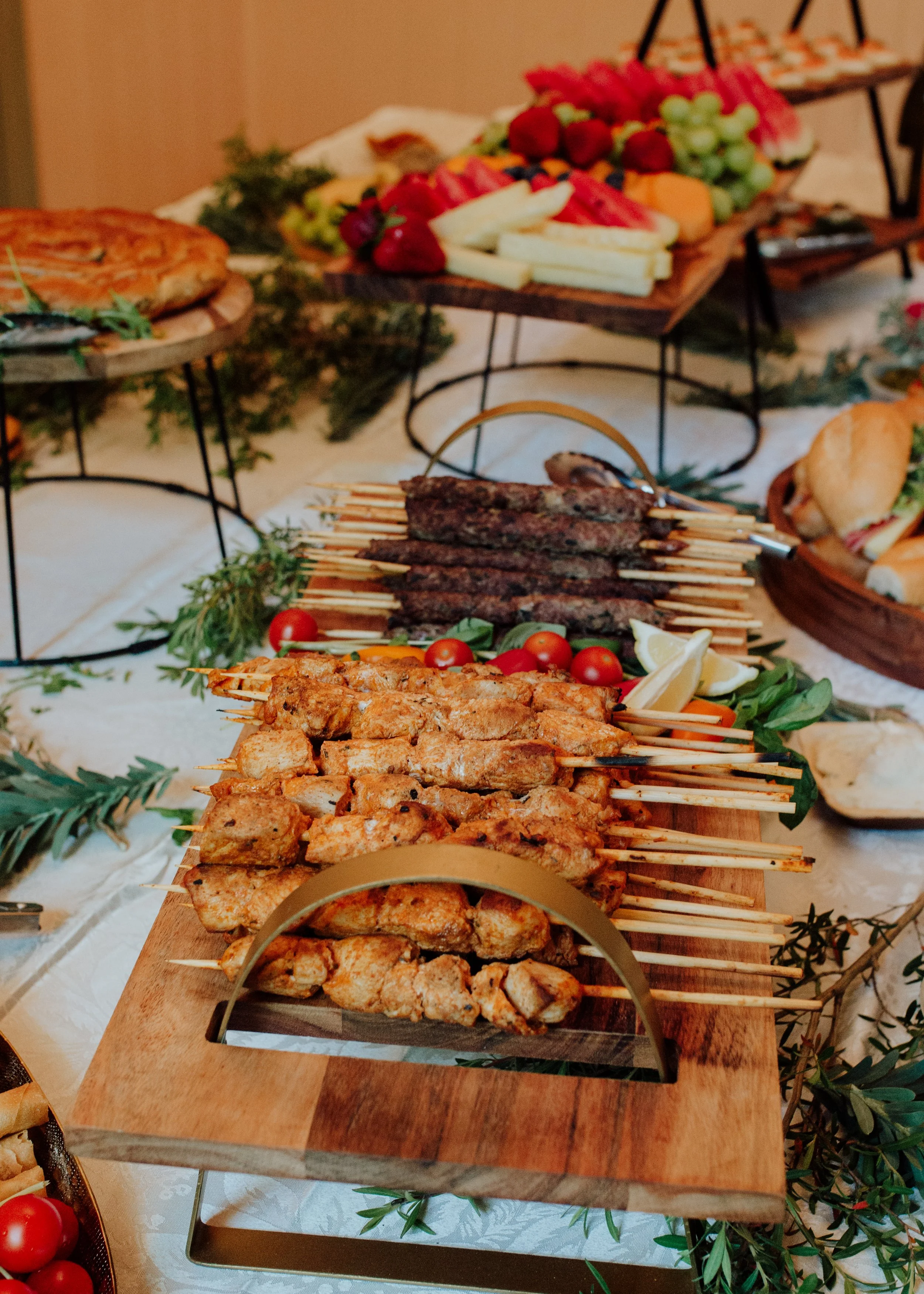 A vibrant buffet of grilled meats, fruits, and pastries prepared for an intimate Blue Mountains elopement reception.