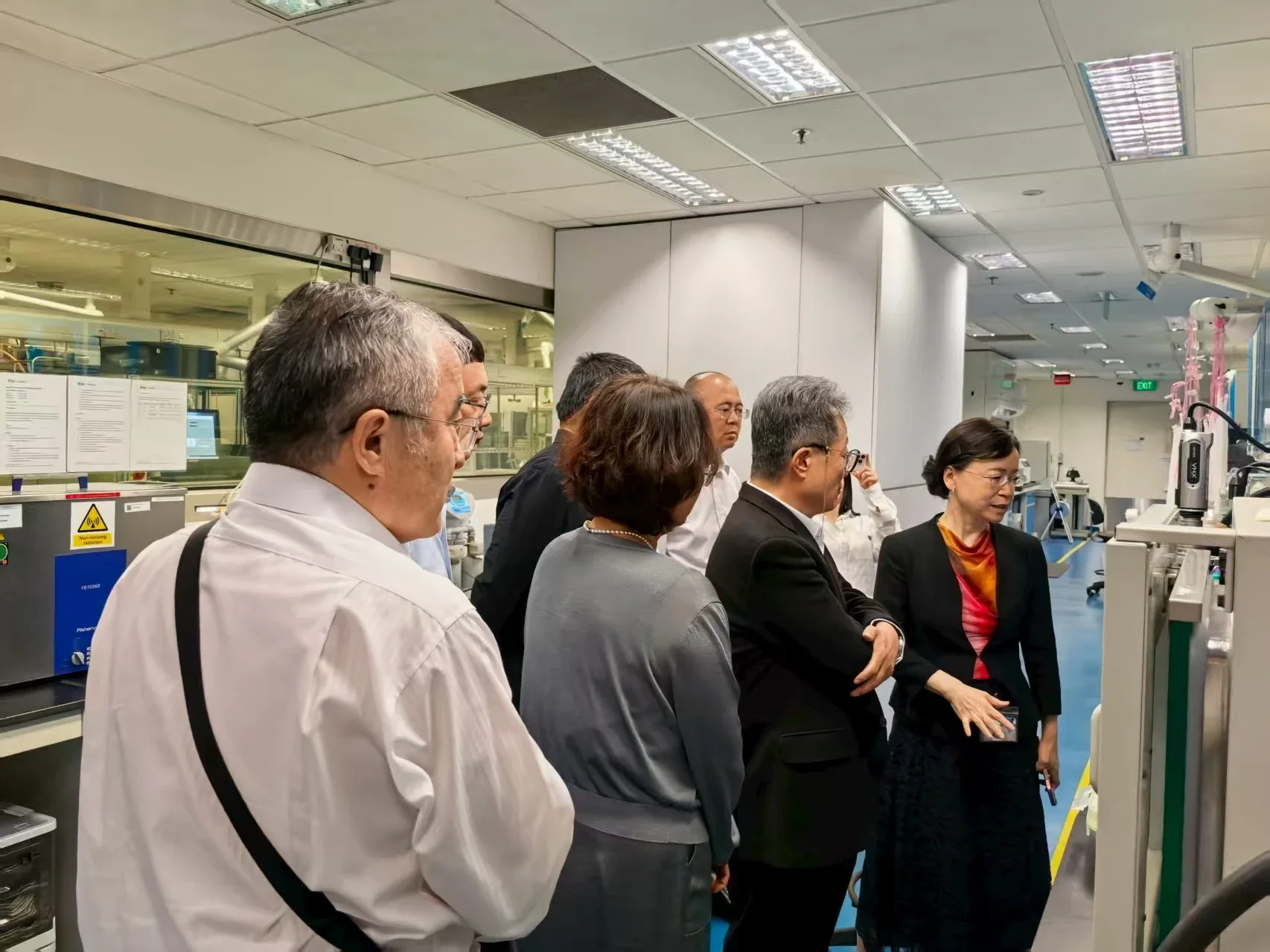 Visiting delegation touring the Singapore Membrane Technology Centre, getting an up-close look at advanced membrane research equipment and facilities.