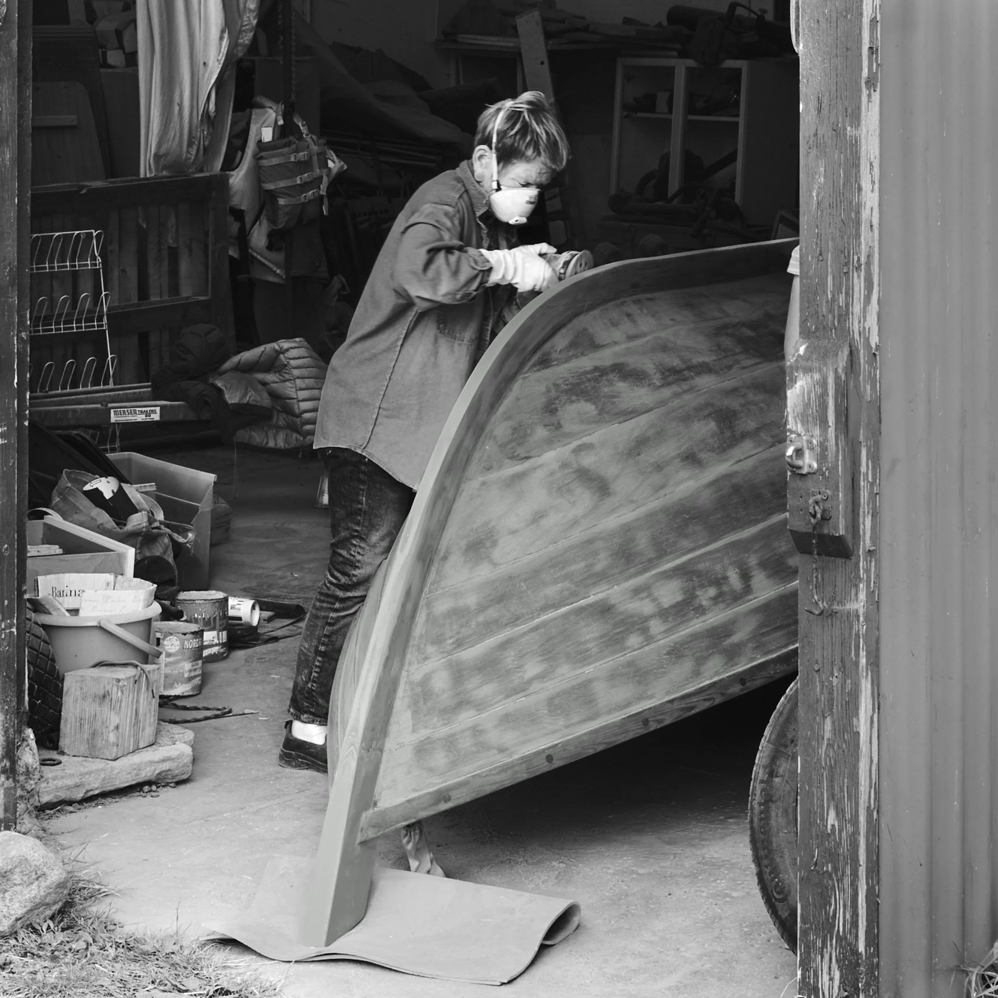 12 - The Restorer. 
Visual emphasis: The restorer’s skilled hands and use of tools, bringing traditional boatbuilding craftsmanship into the present through practical work and technological adaptation.
"Traditional craftsmanship meets modern tools in