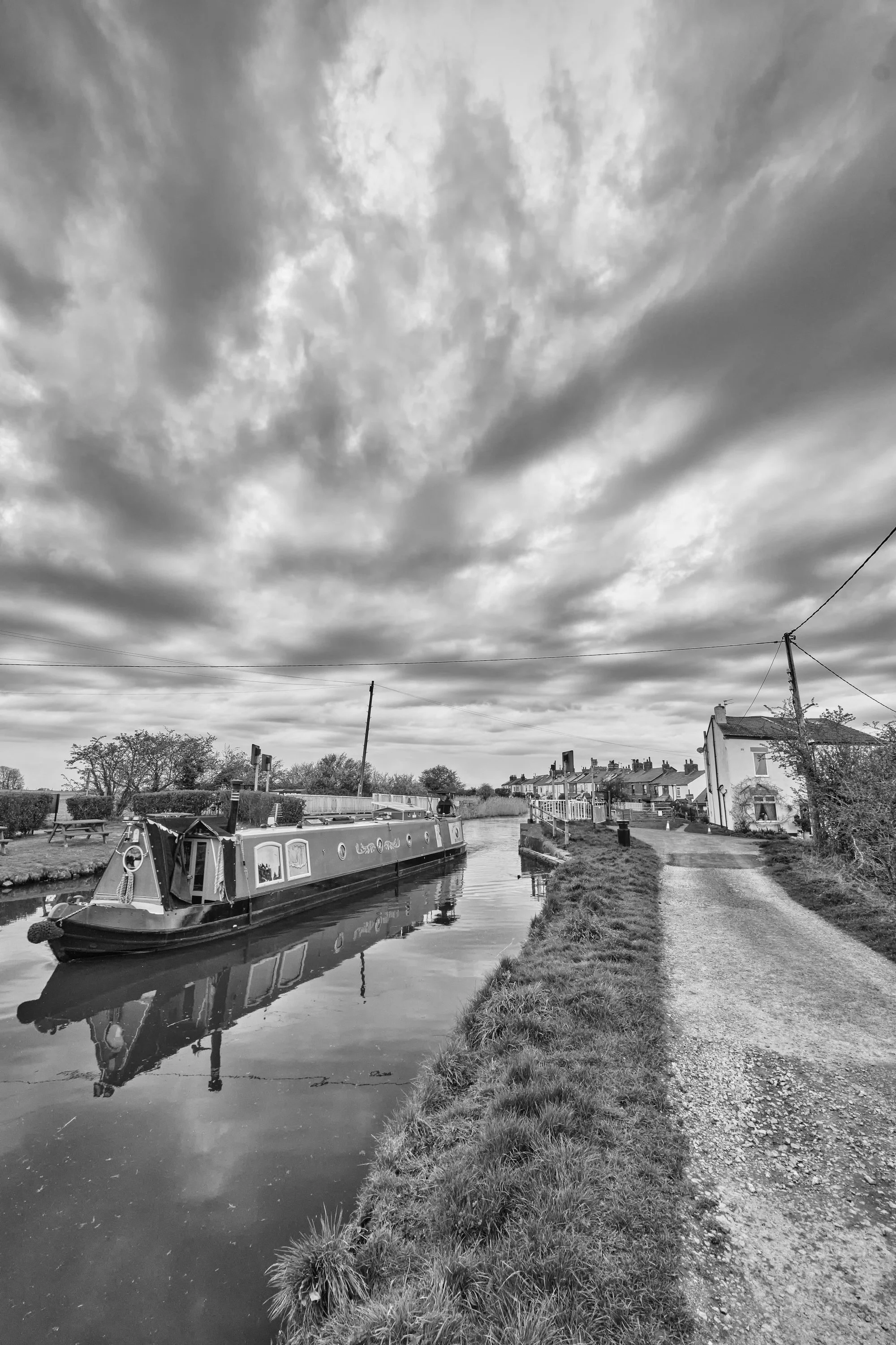 Leeds & Liverpool canal.  Once conveying farm produce and coal to the industrial revolution major cities of the north now leisure pursuits prevail; Lancashires Lost Lake. Image three of a sequence of 5 observing the rural landscape of West Lancashire