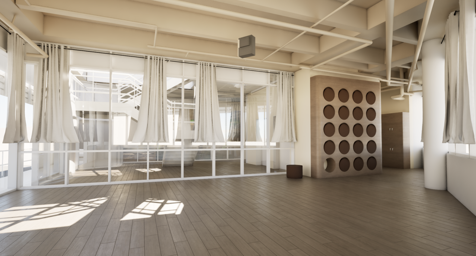 Empty room with large glass windows and white curtains, sunlight casting shadows on wooden floor, modern decor with circular cutouts on a wall divider.