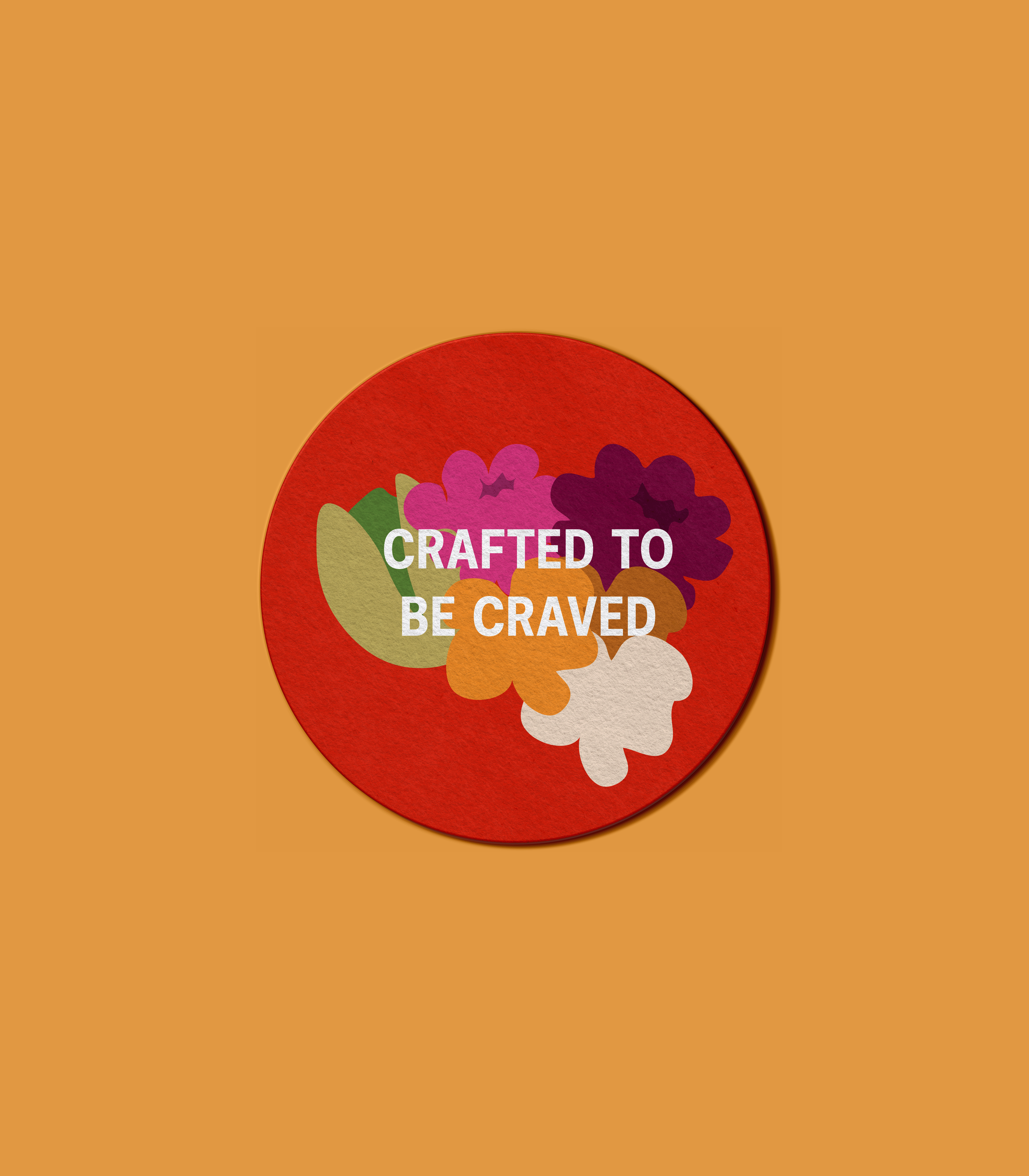 Red circular sticker with colorful illustrations of berries, pistachio nusts and popcorn, and the phrase "Crafted to be Craved" in white text. designed by Abubakr Moolla Brand Designer from East London.