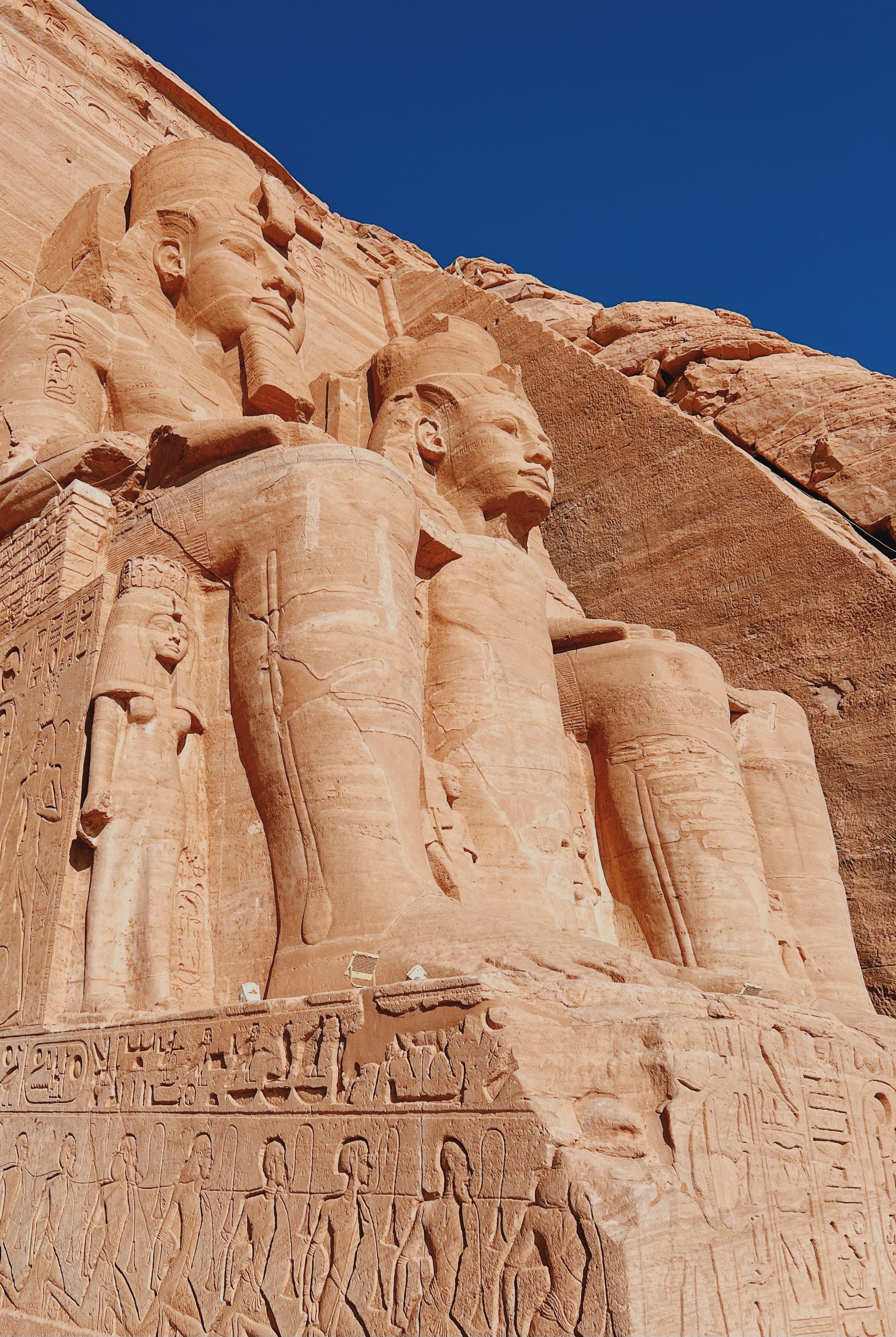 The colossal seated statues of Ramesses II on the facade of the Great Temple of Abu Simbel.