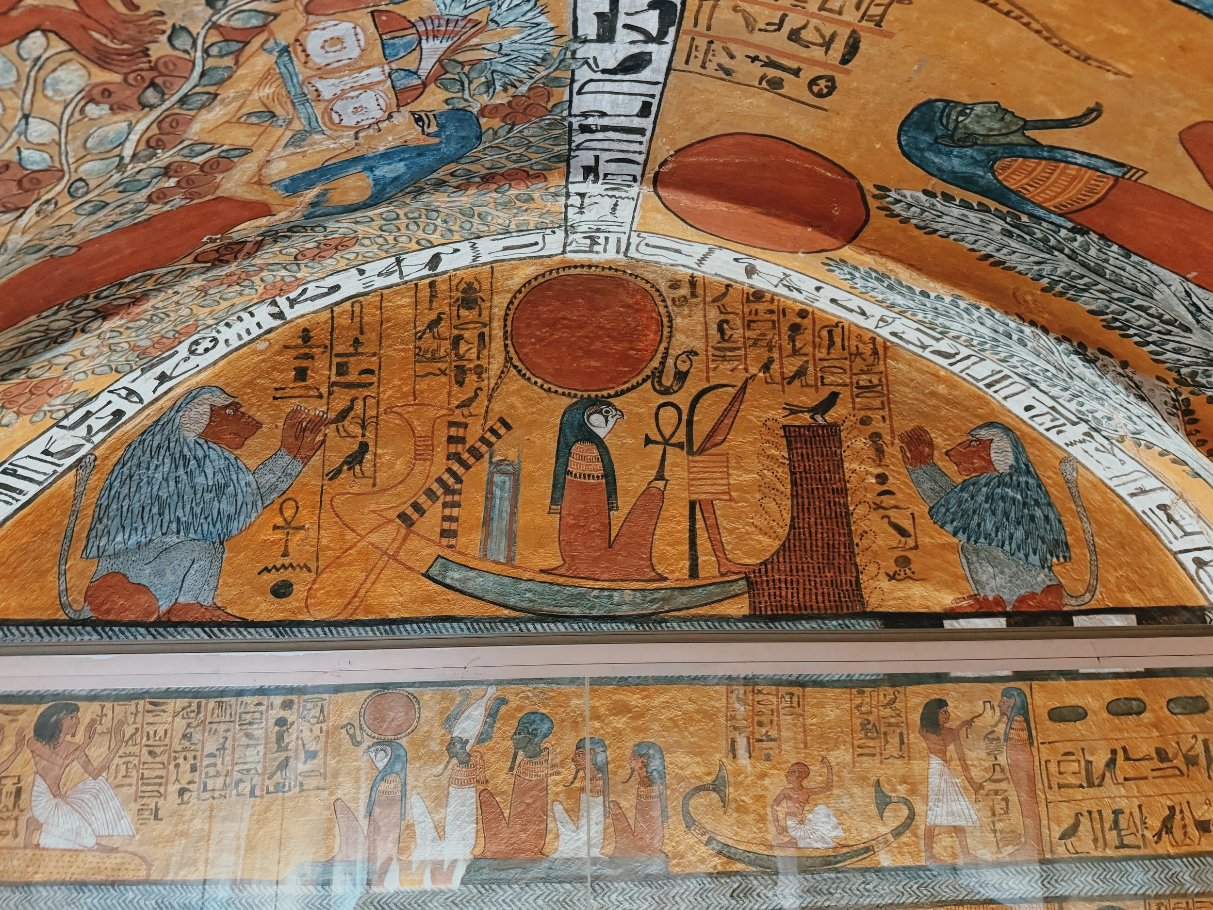 Painted baboons adoring the sun god Ra-Horakhty in his solar boat in the Tomb of Sennedjem at Deir el-Medina, Luxor.