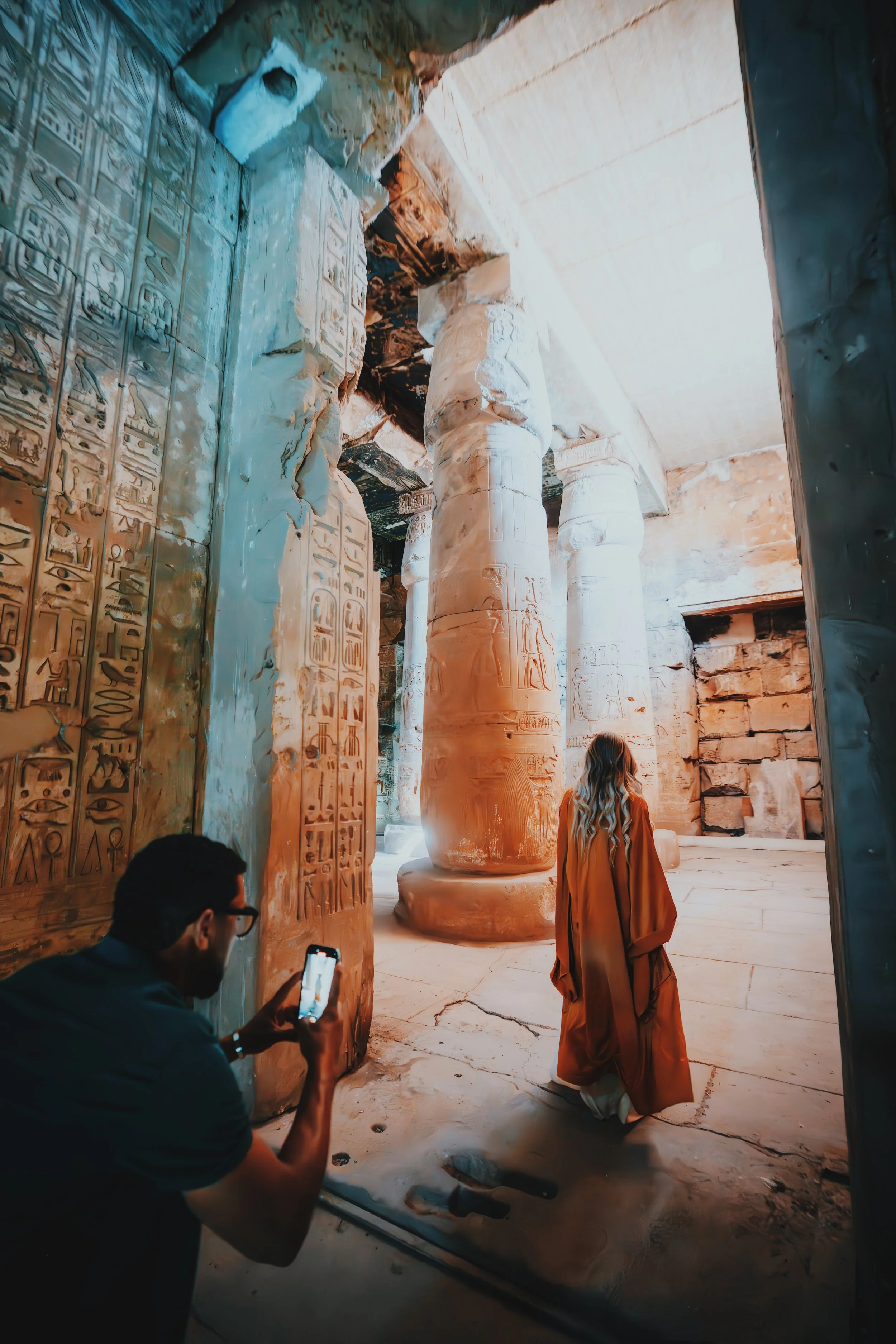 Jennifer and Mostafa of Takemet Tours during a photo session among the columns of the Temple of Seti I at Abydos.