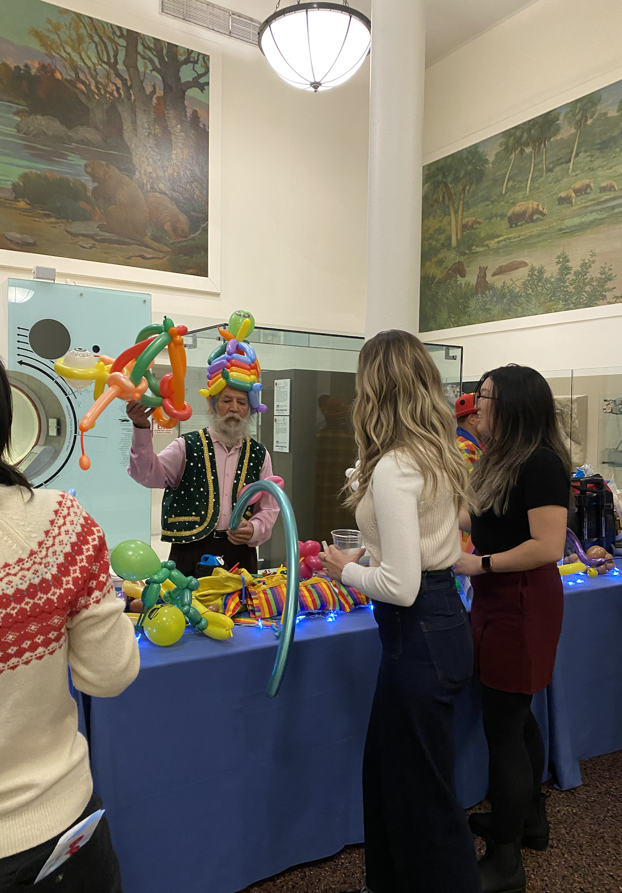 At the JC and Corporate Holiday Party, our longtime balloon artist brings joy to members. I intentionally draw from vendors with a history at the Museum, ensuring that the talent we bring in not only entertains but also reflects a real connection wit