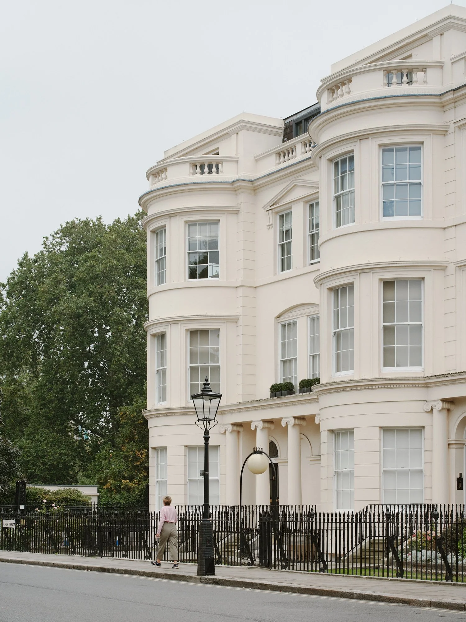 Cream stucco bow fronts and balustrades of Ulster Terrace, a Grade I listed John Nash terrace on Regent's Park, home to Tarisio London