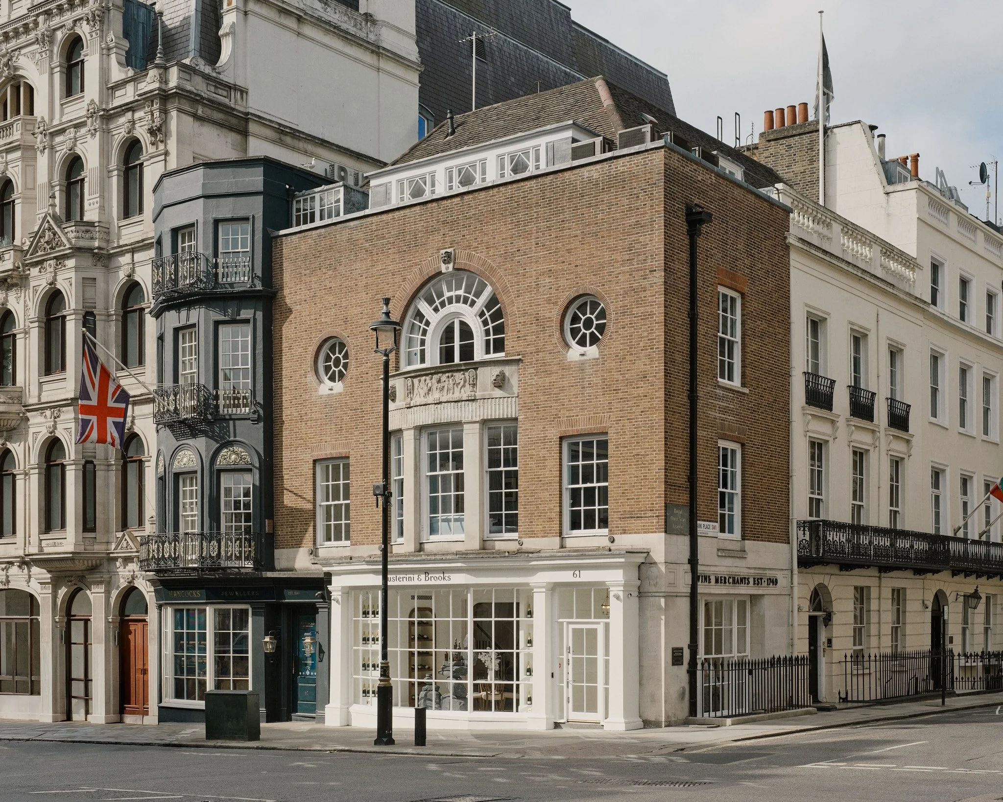 Street view of the Justerini & Brooks townhouse on St James’s Street, a corner building in the St James’s Conservation Area, Westminster.