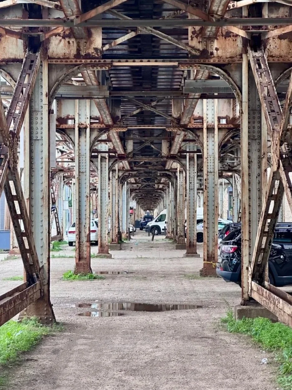 Chicago's elevated 'L' train tracks, the steel beams and curved brackets that informed The Row's facade.