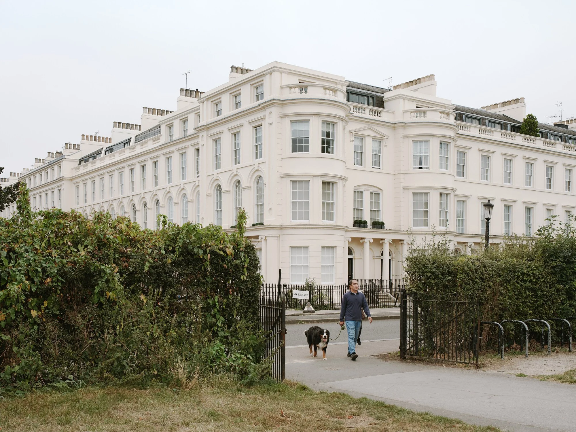 Cream stucco bow fronts and balustrades of Ulster Terrace, a Grade I listed John Nash terrace on Regent's Park, home to Tarisio London