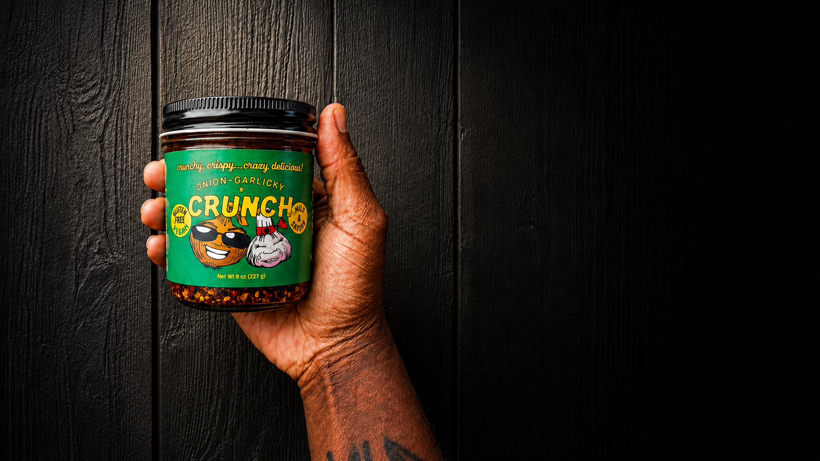 Chef T holding her signature OG Crunch chili crunch