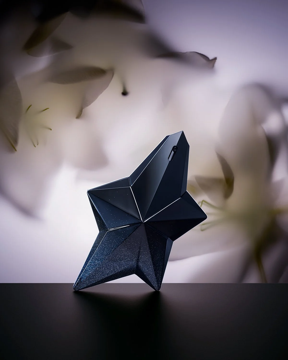 Mugler_Star_12x15px.jpg