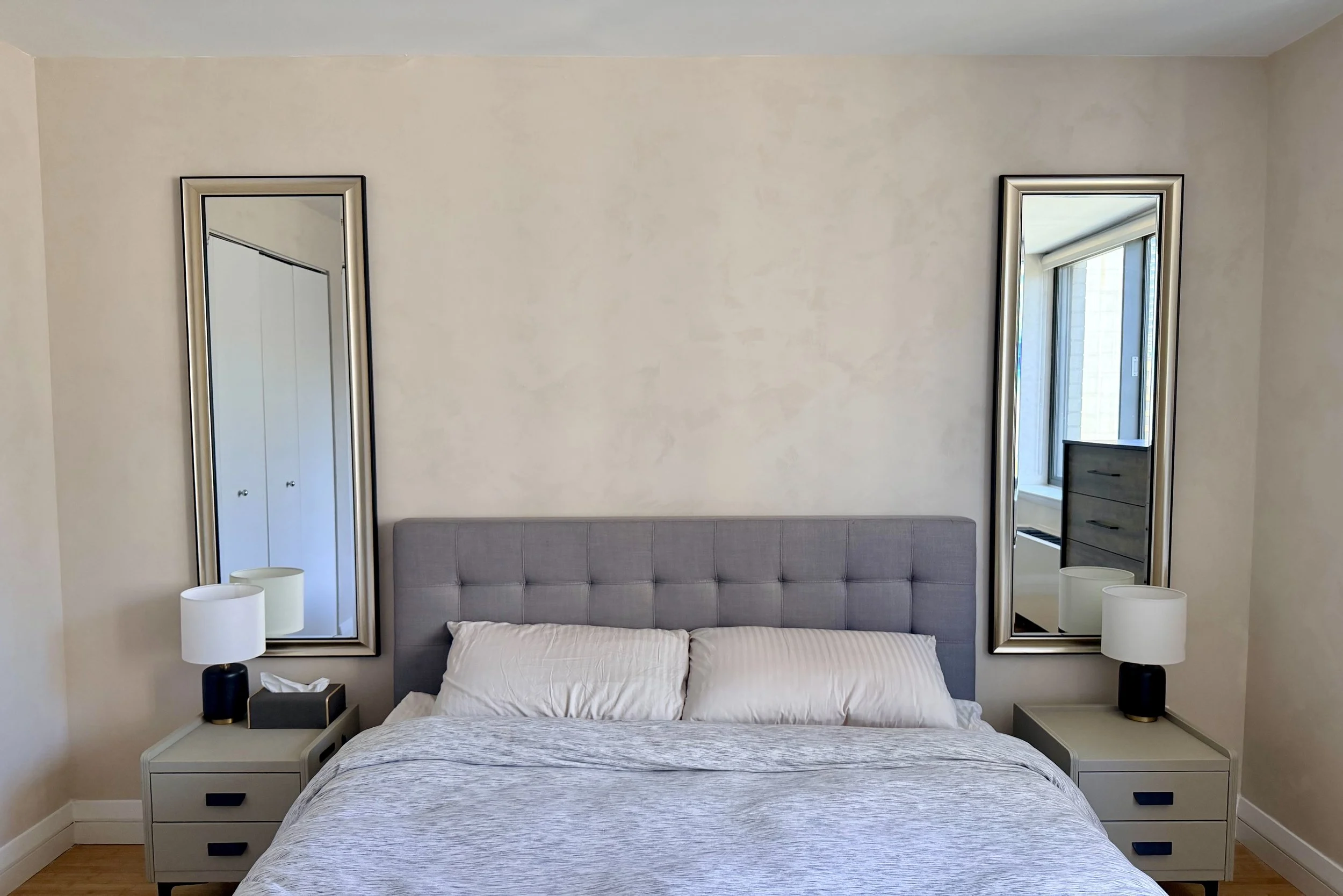 Soft cream limewashed bedroom with twin mirrors flanking the bed — Warm Neutrals, Nomad project by Limewall & Co.