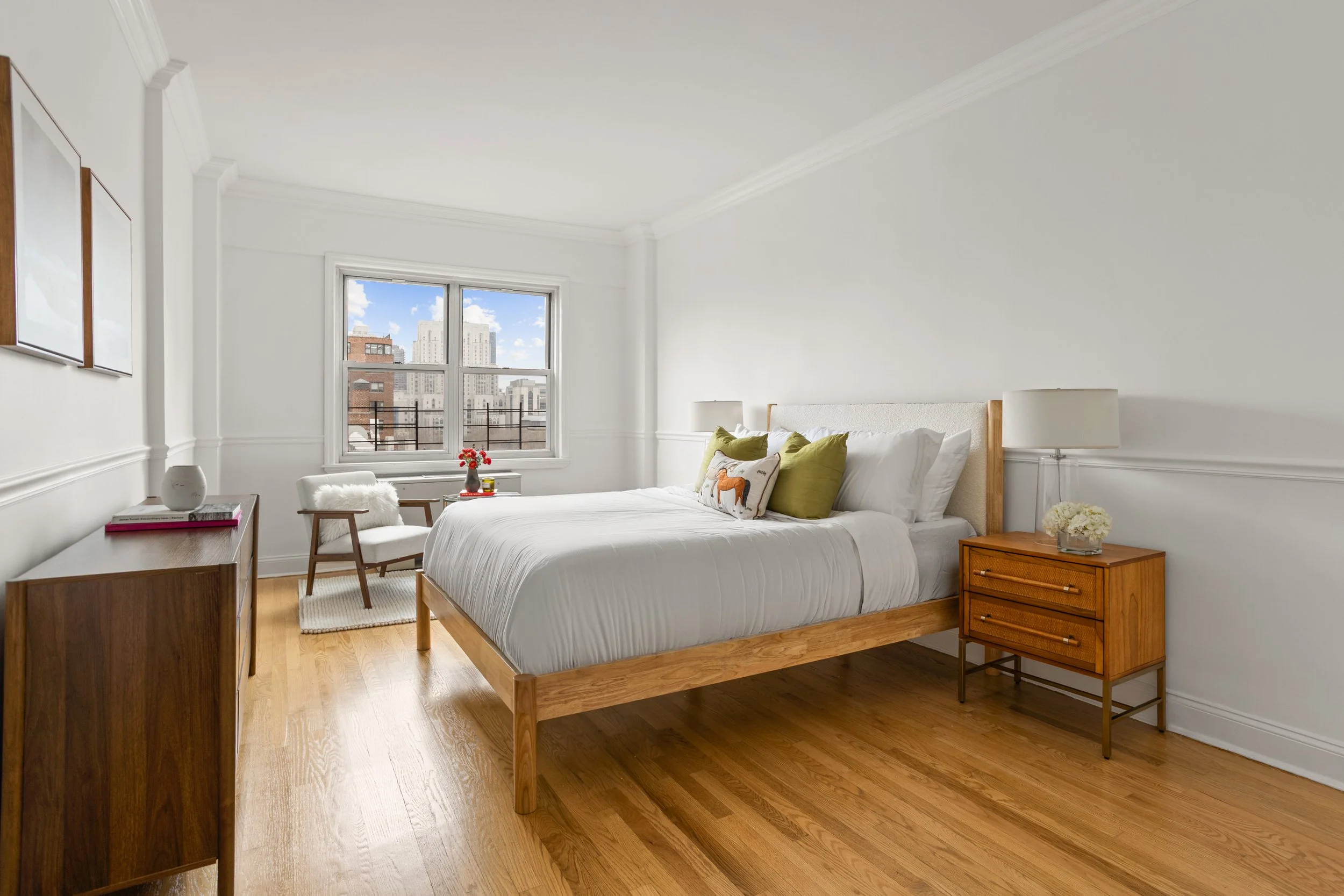 Bedroom with city view and midcentury furnishings — Upper East Side co-op, Limewall & Co.