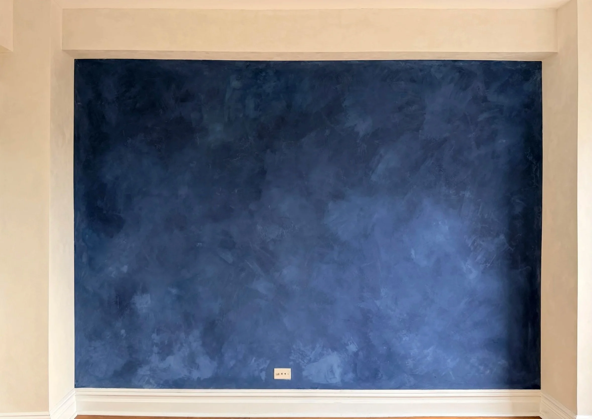 Deep navy limewash accent wall in West Village apartment — Limewall & Co.