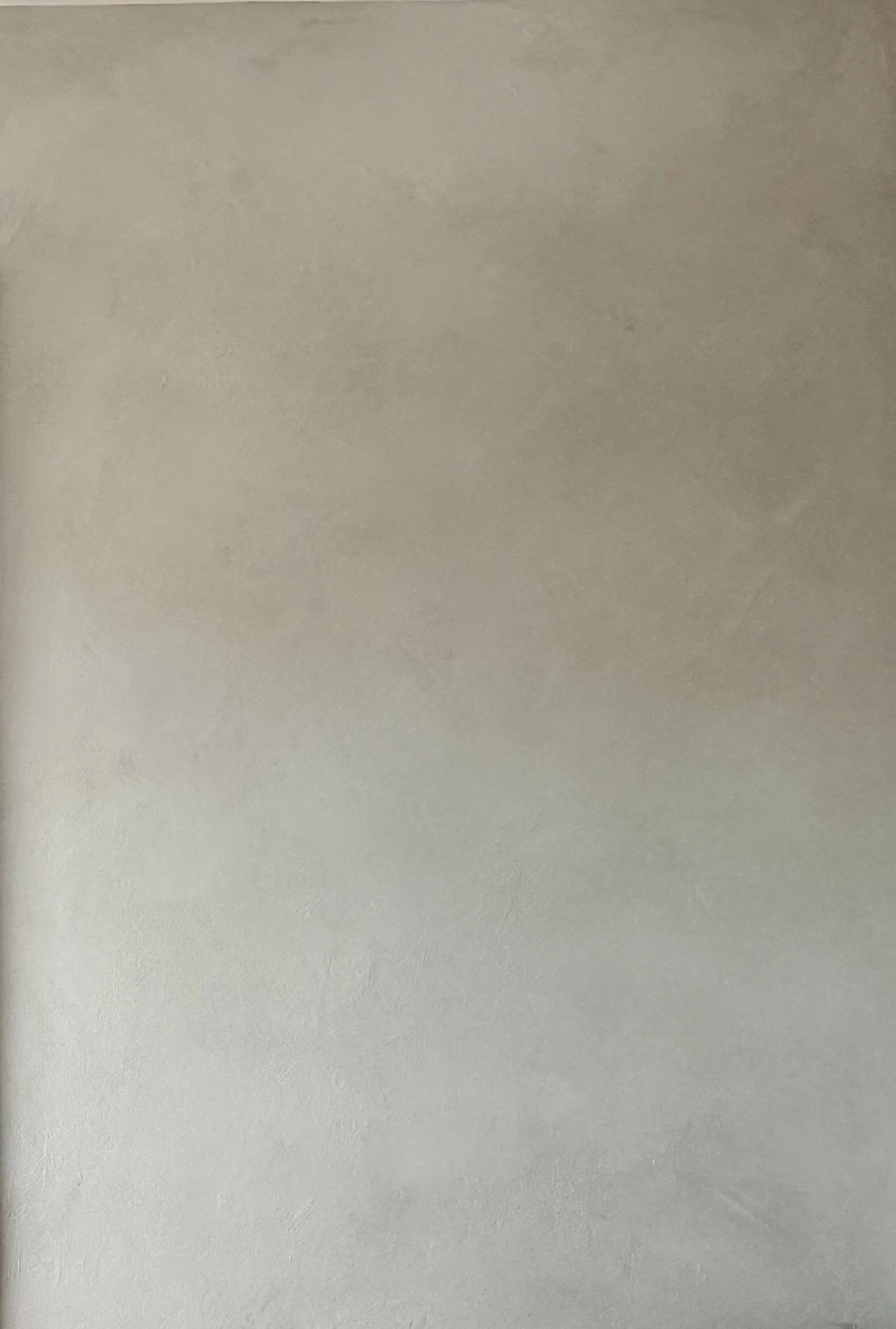 Close-up of hand-applied cool gray limewash showing soft brushwork and tonal variation — Limewall & Co.