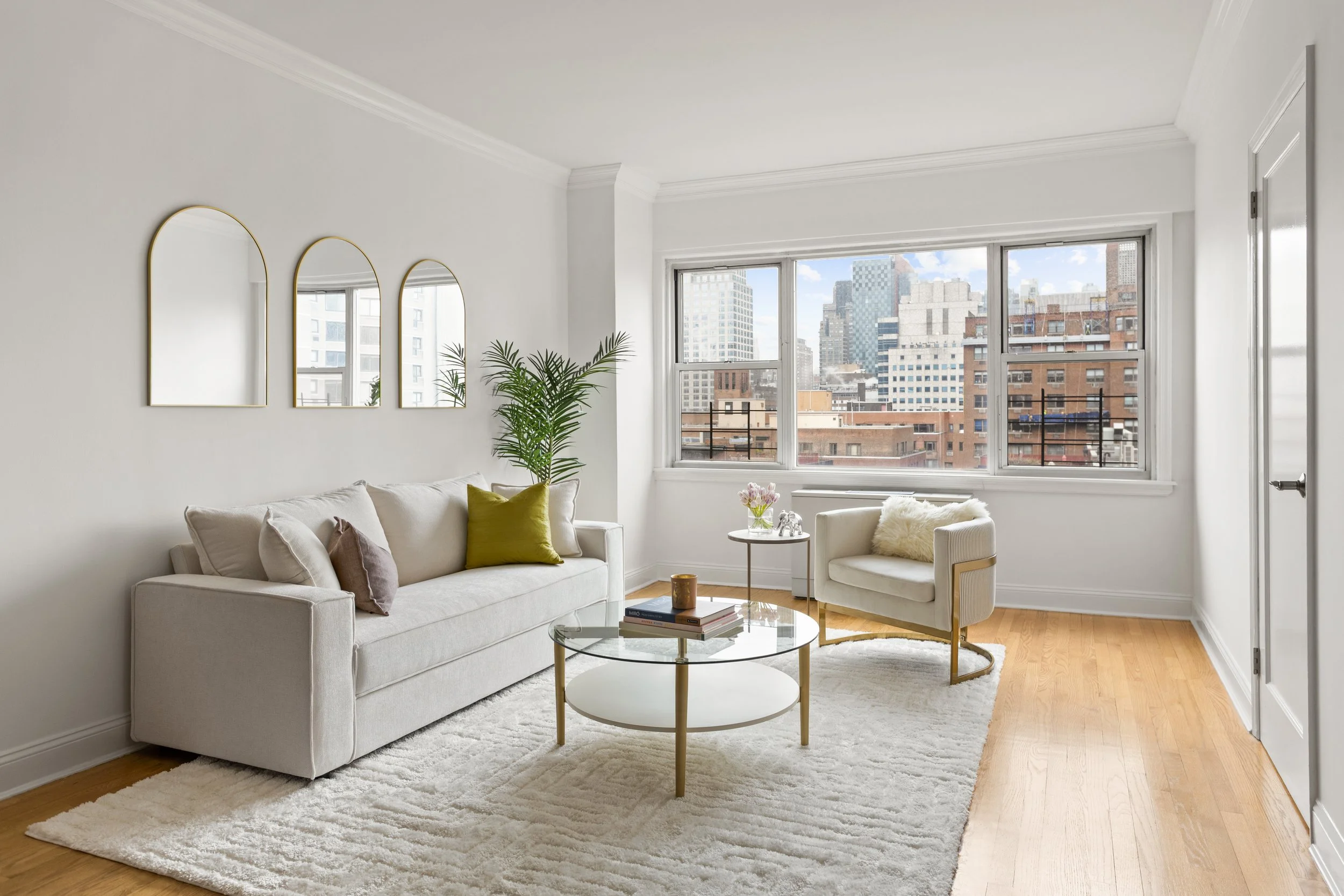 Bright Upper East Side living room with white walls and city view — Limewall & Co.