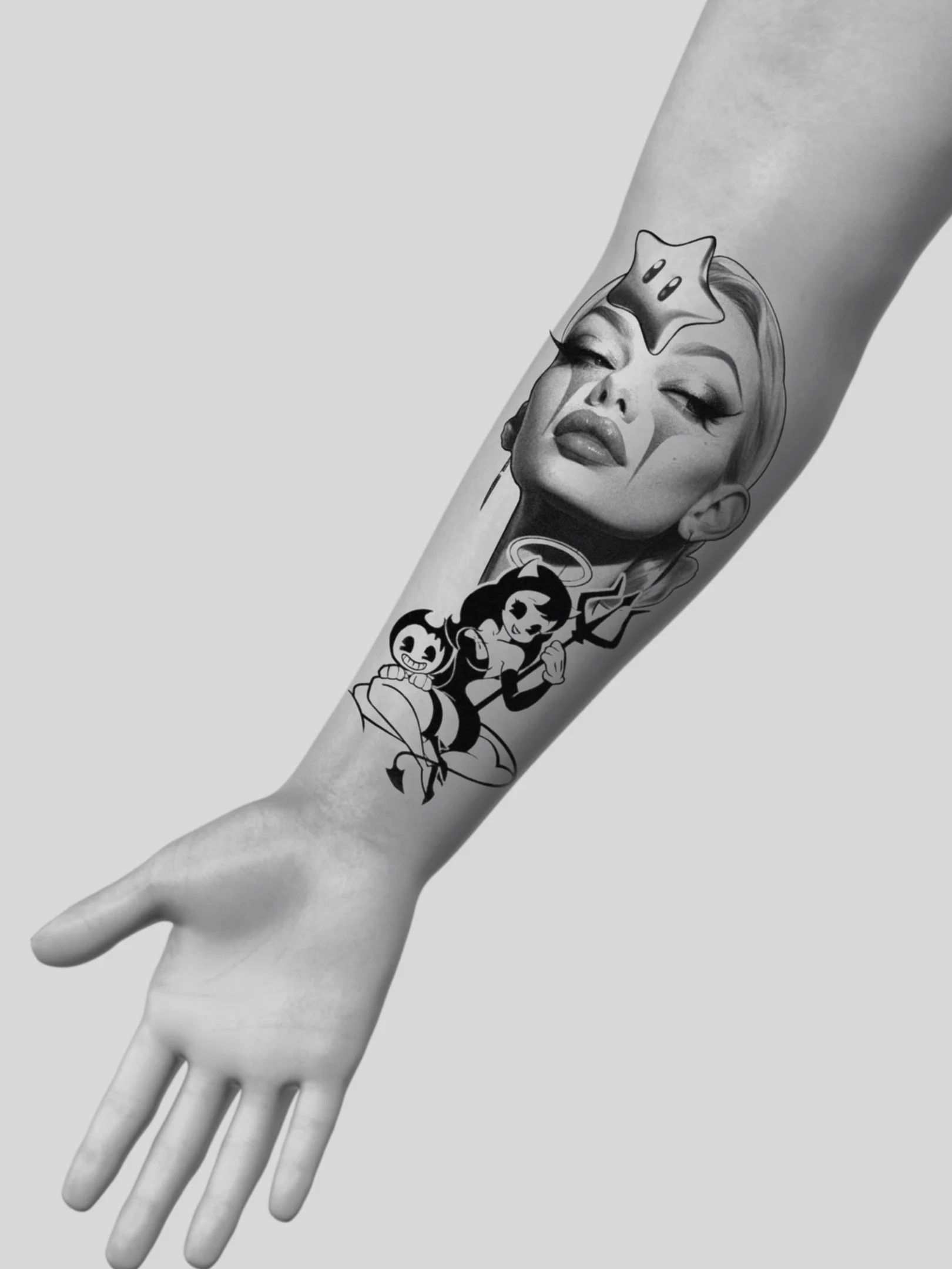 Tattoo of a woman's face with vintage pin-up style makeup and a star above her forehead, along with cartoon characters below, on a person's forearm in black and white.