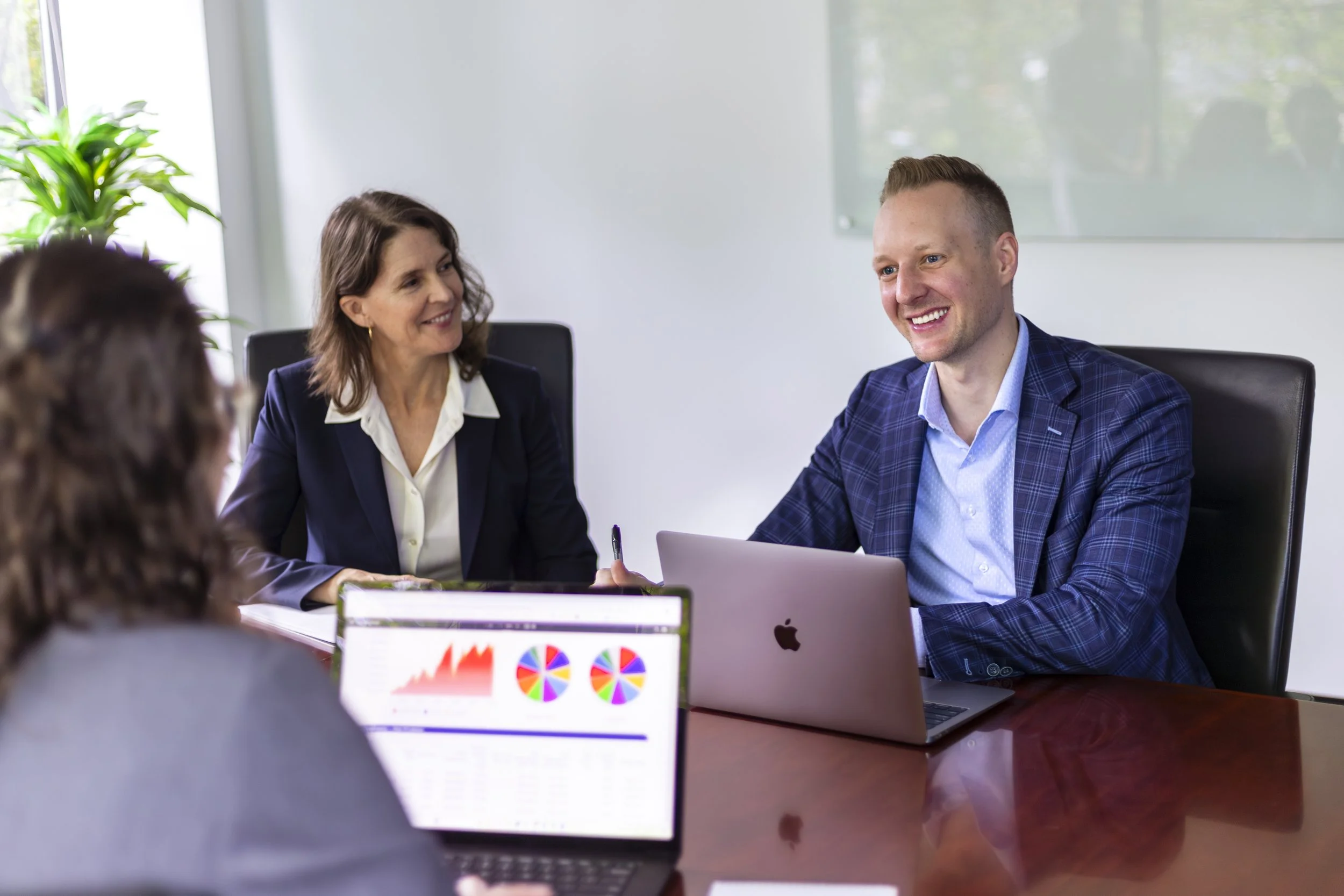 Glenn Rossman, a fiduciary advisor in Santa Monica Bergamot Arts District CA, works with his team at TrueWealth Financial Partners.