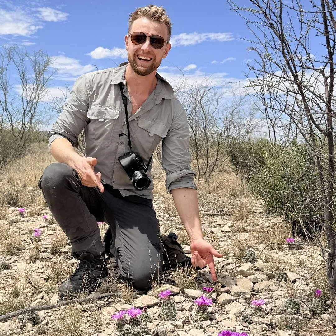 Stefan Campbell exploring cacti in habitat
