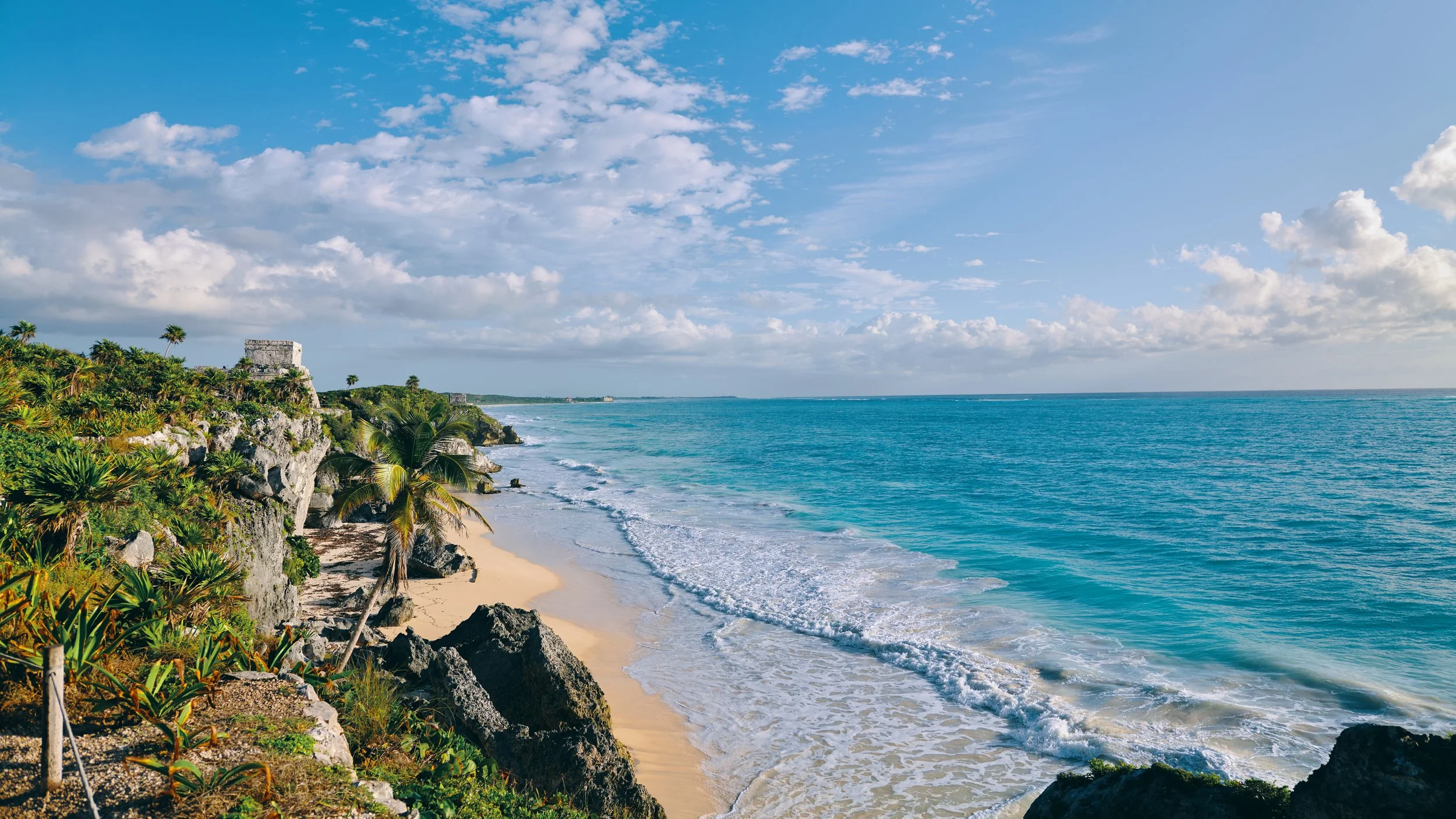 An impossibly beautiful blue sea beside the ancient ruins
