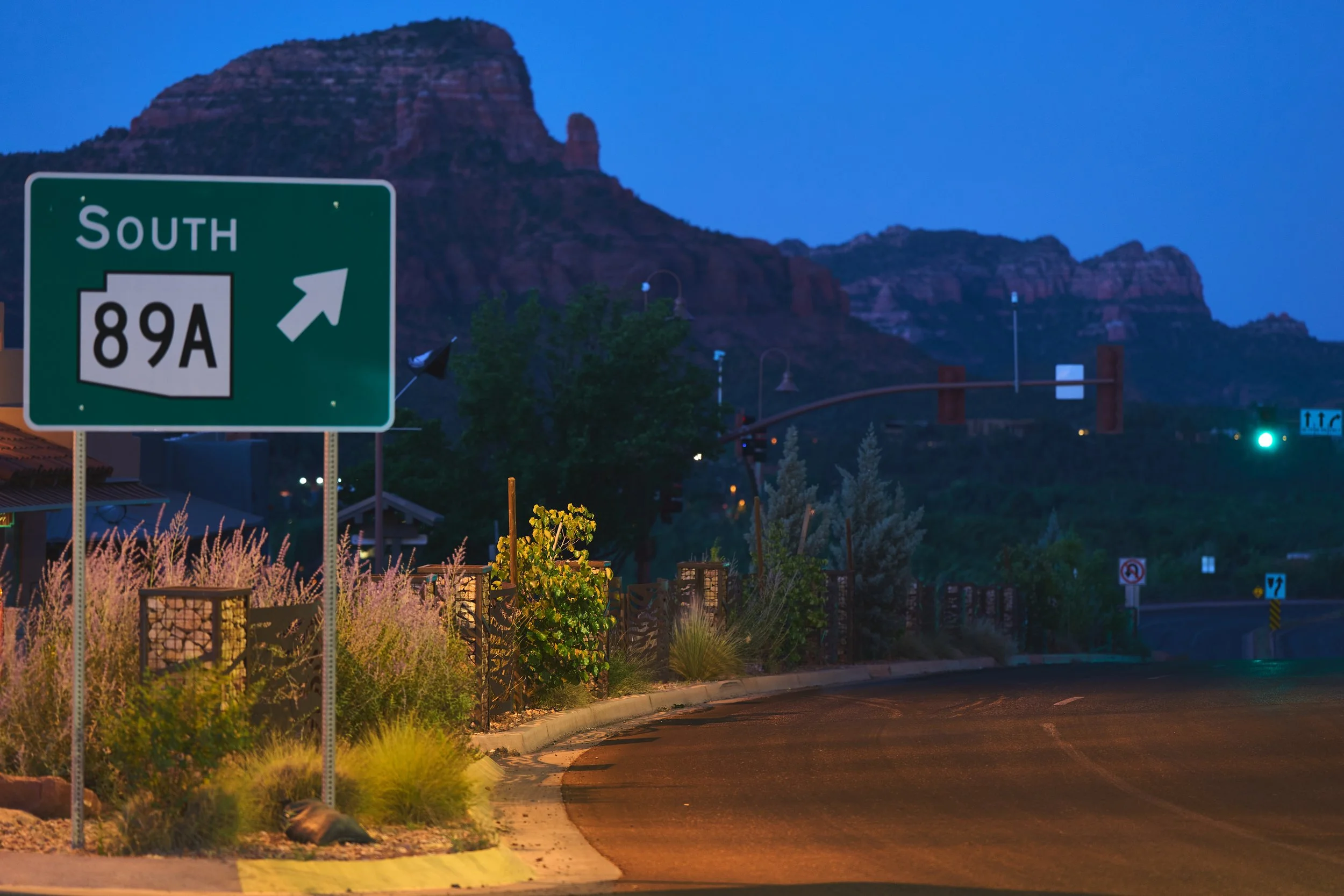 Sedona waking in the quiet dawn, with red rocks softly glowing in the first light of day.
