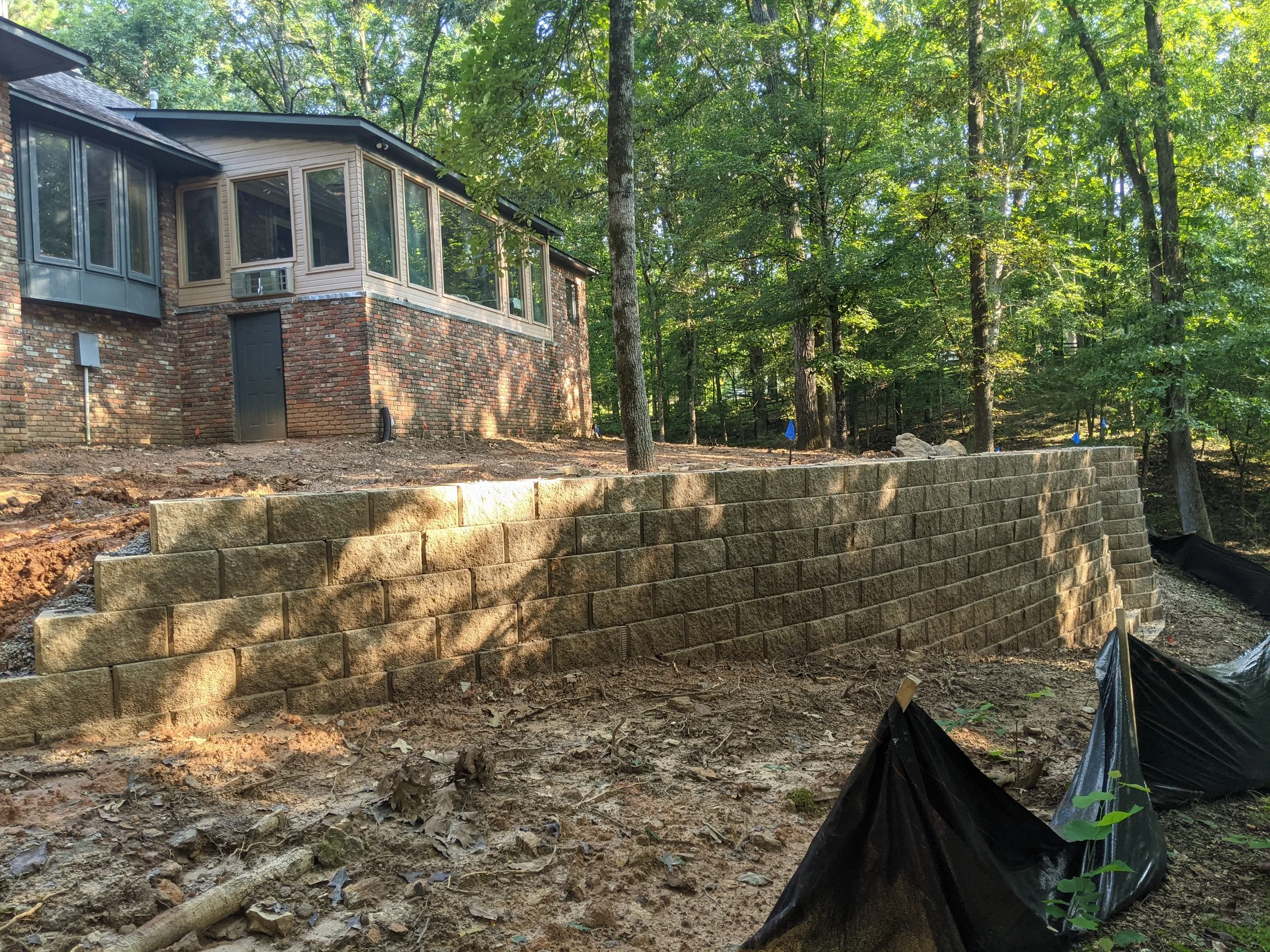 Retaining wall before landscaping