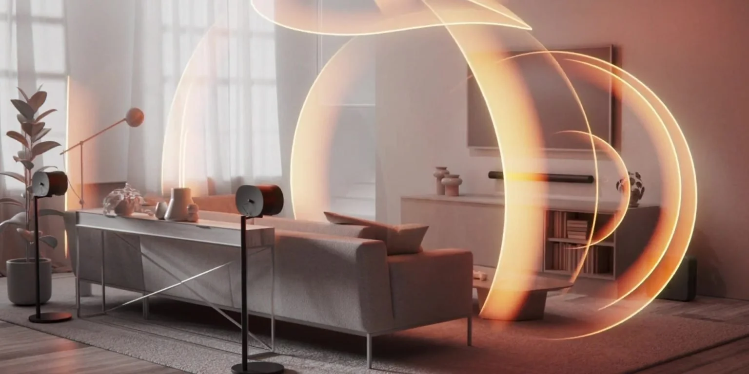 A modern living room with glowing orange sound waves swirling around sonos arc ultra, and era 300 speakers, illustrating immersive audio technology.