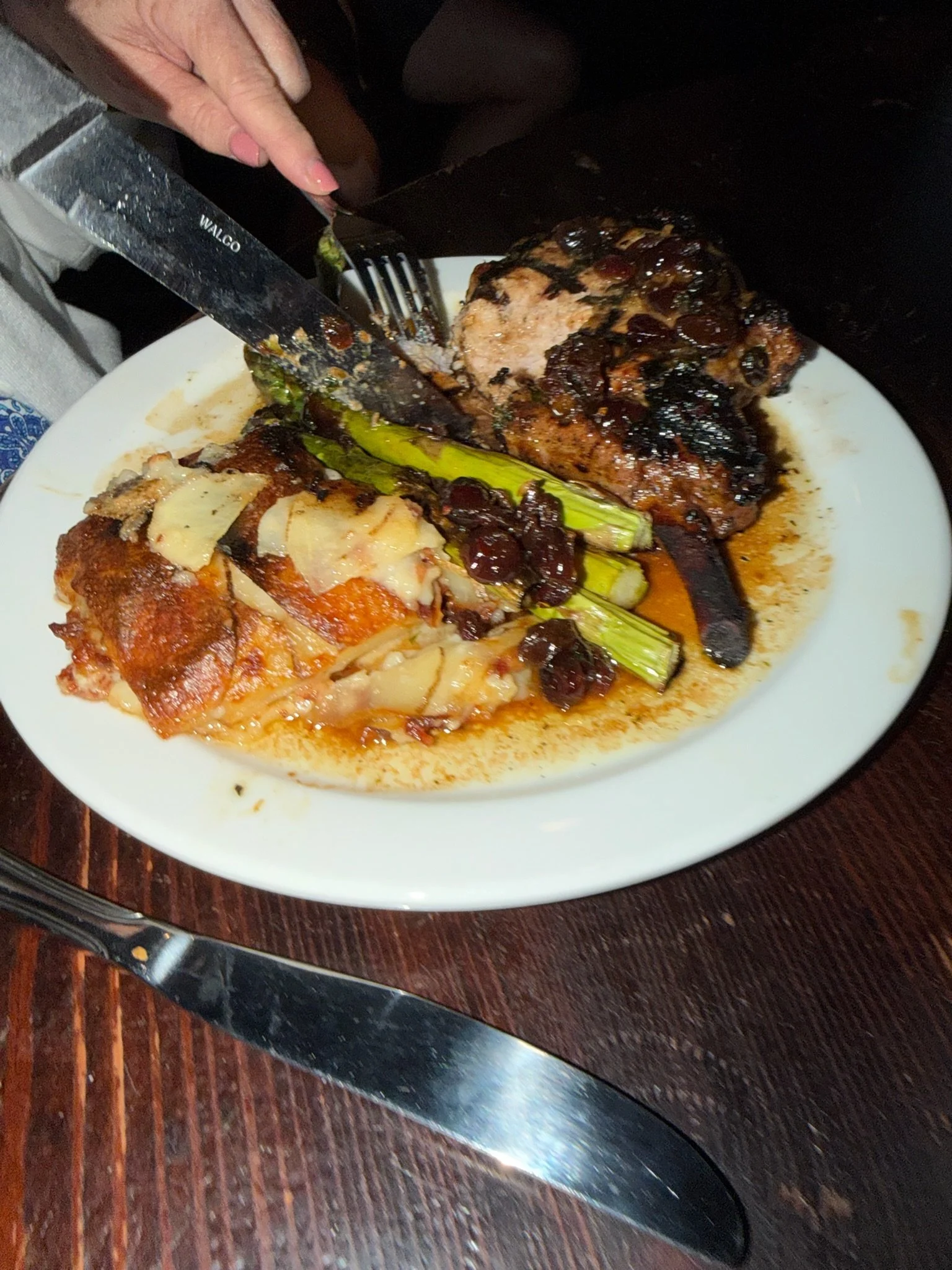 Pork chop at John D. McGurks Pub with potatoes and asparagus