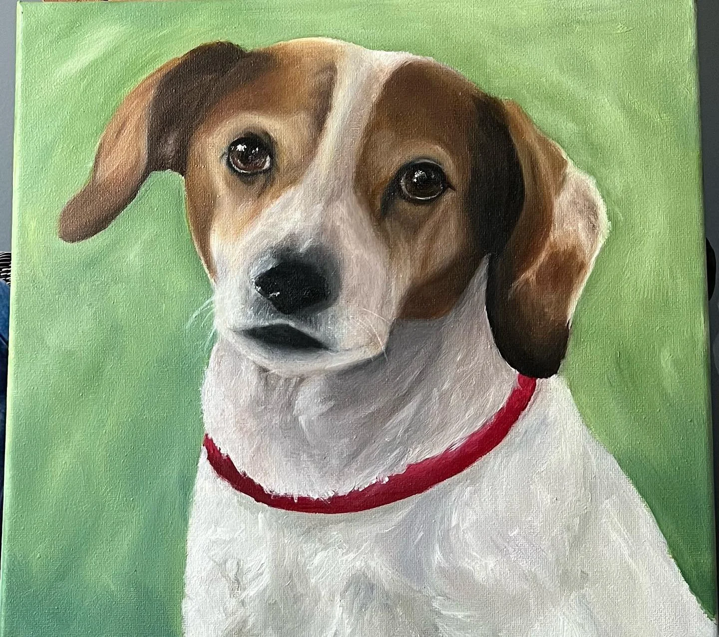 Oil painting of a small dog with a white and brown coat, wearing a red collar, against a green background.