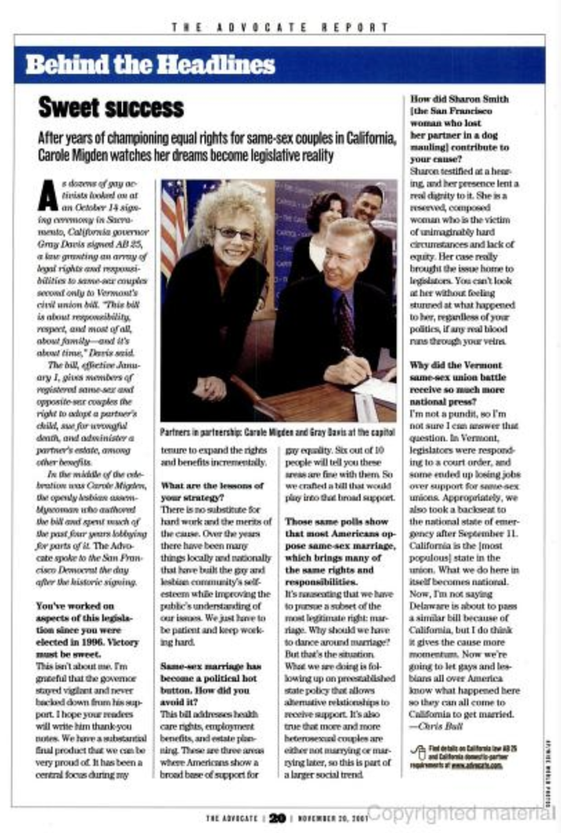 Photograph of Carole Migden and Gray Davis at the Capitol during a legislative event, smiling and seated at a table.