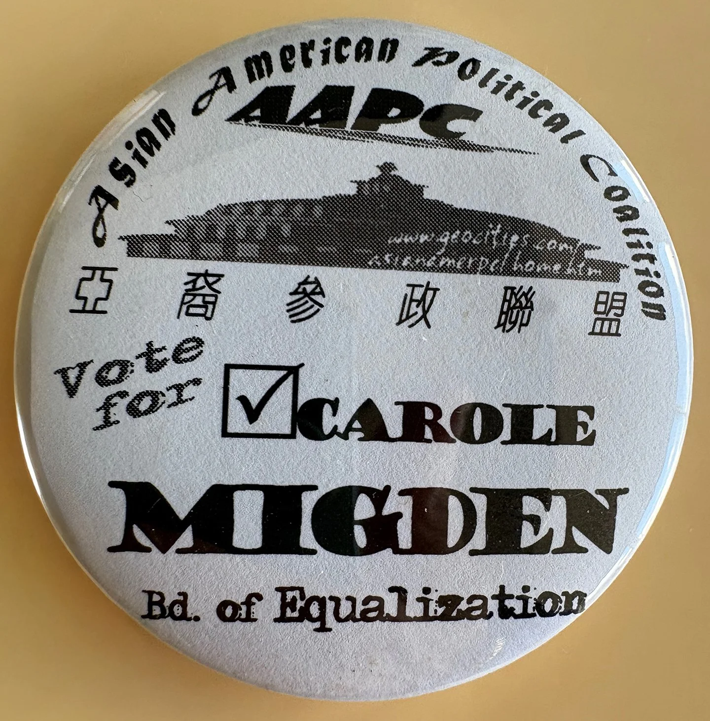 A circular button with the text 'Vote for a CAROLE MIDDEN' and 'Bd. of Equalization.' The button features the Palace of Fine Arts in San Francisco in black and white.