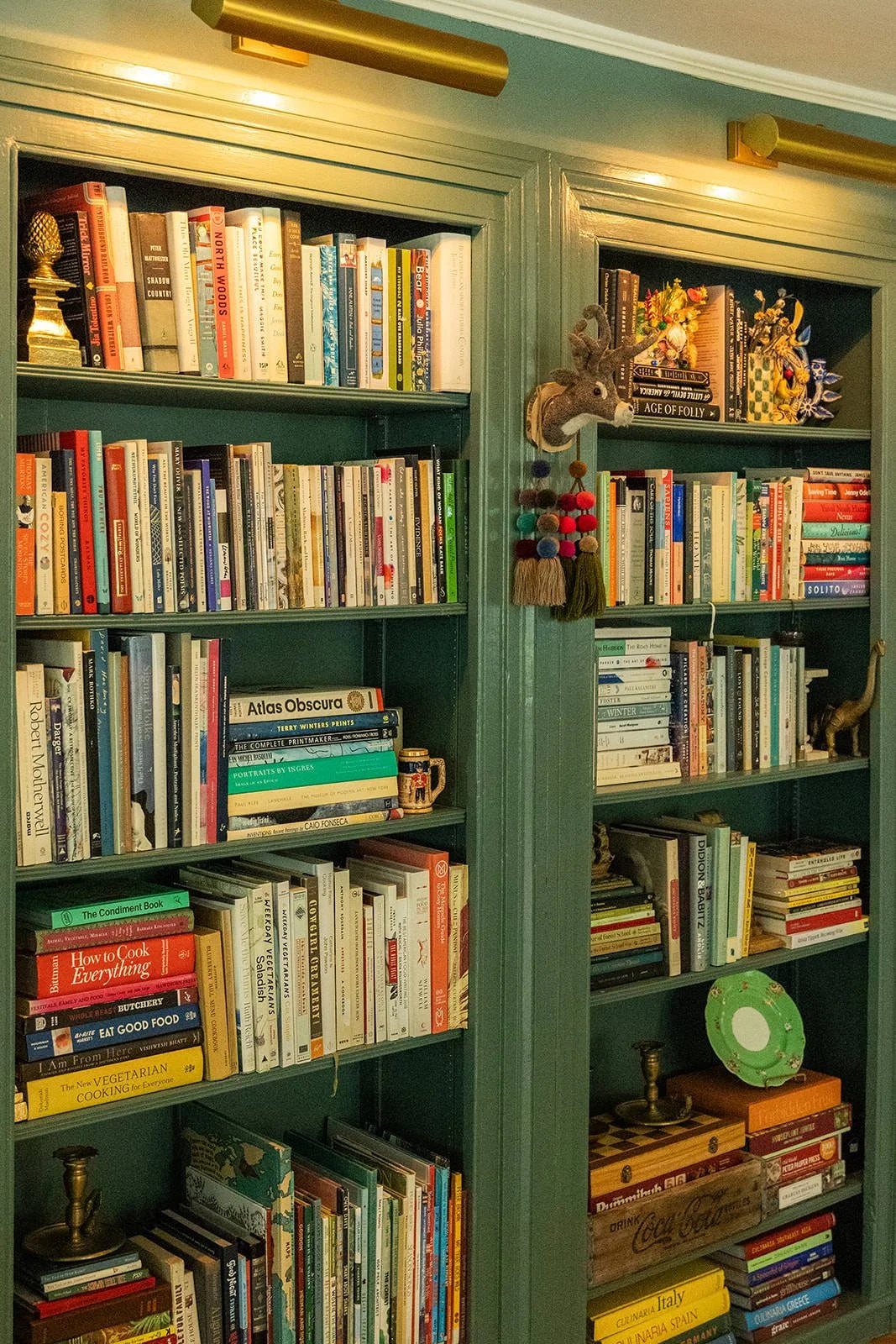 A thoughtfully curated book shelf in the parlor