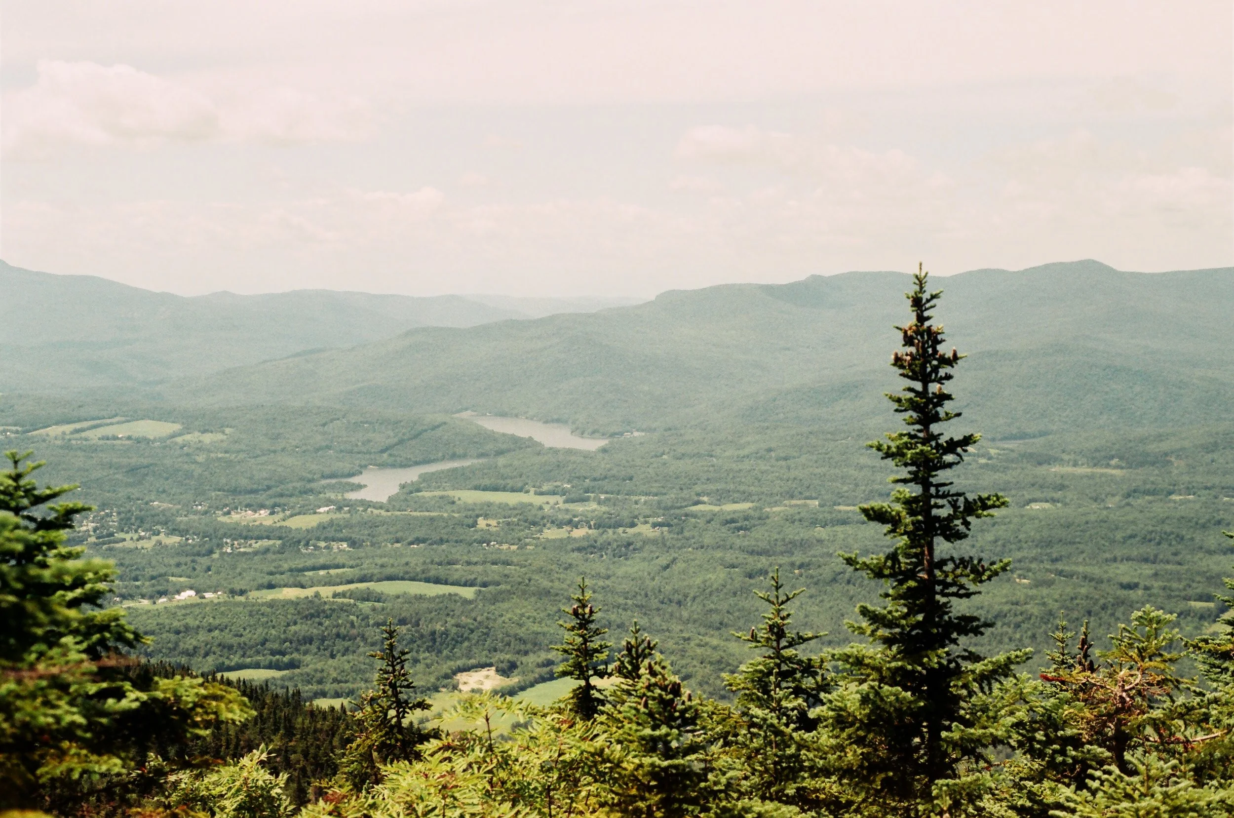 the view at the top of a mountain looking out over Vermont