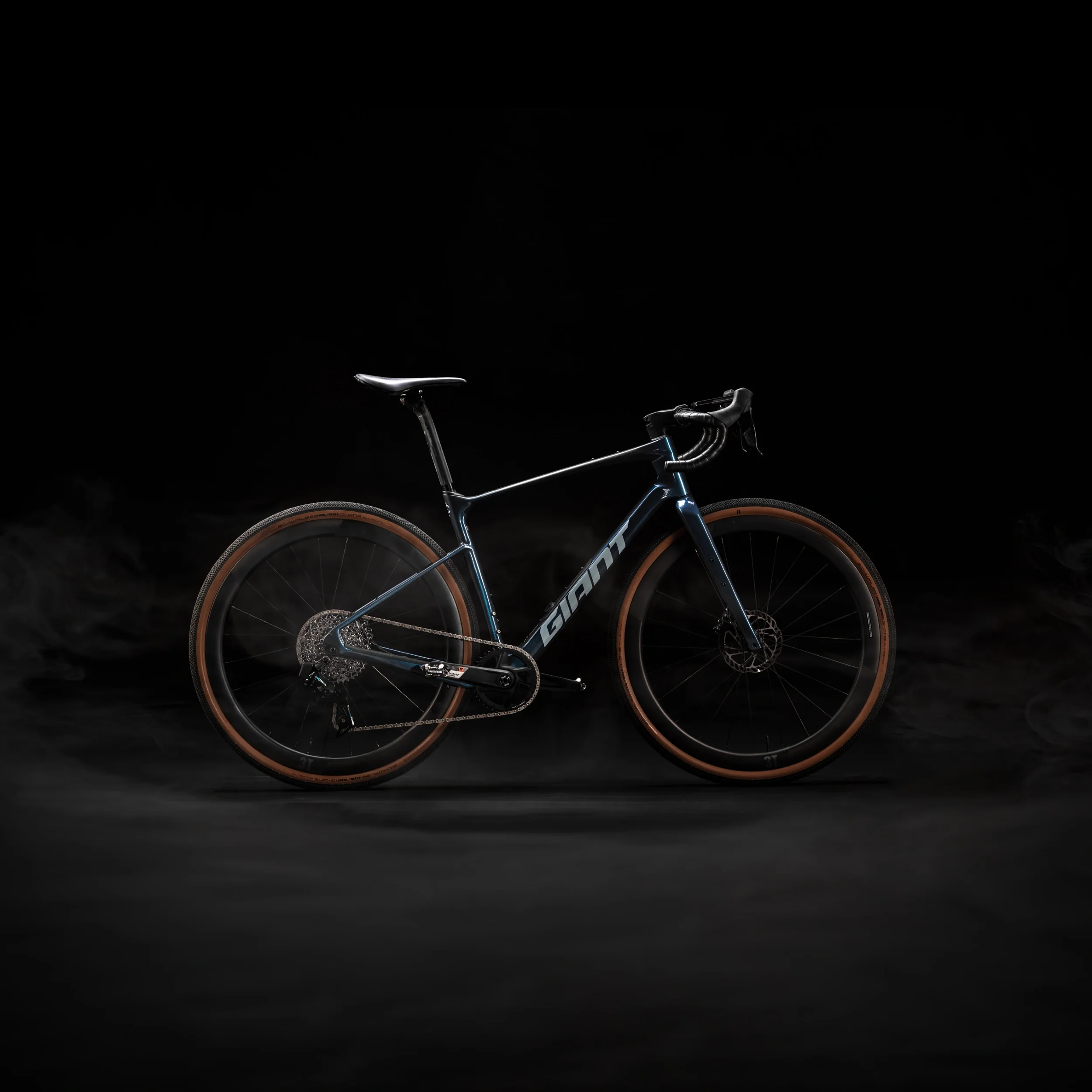 commercial product photography studio image of a giant bicycle on a dark background