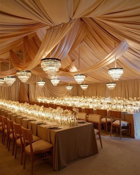 Our couple wanted their guests to feel fully transported — to experience a completely different atmosphere from their ceremony. We spent days transforming their tent into a dramatic, chic, and undeniably sexy space. The tent was divided to crea