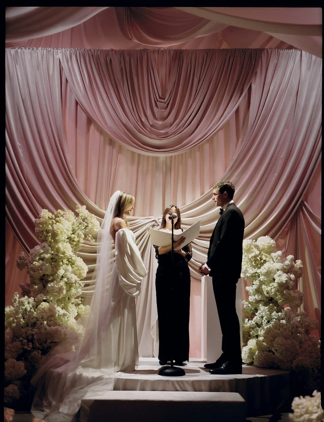 Our client had a clear image of her ceremony &mdash; set in front of structural drapery and officiated by their shared best friend, the person who brought them together in the first place.

Planner: @rachelbeharevents
Venue: @99scott_
Photo: @chellis