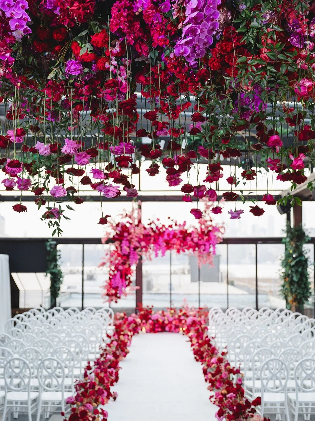 Our ceiling was dripping in pink and red roses, which wove so beautifully into the abstract altar.

Planner: @rachelbeharevents 
Venue: @74_wythe
Catering: @pinchfooddesign
Photographer: @katieosgoodphoto 
DJ: @jamesmulry
Lighting/AV: @shadesofgreypr