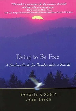 Book cover titled 'Dying to Be Free: A Healing Guide for Families after a Suicide' by Beverly Cobain and Jean Larch, with a pink and purple sunset over a forest silhouette and a white dove at the bottom.