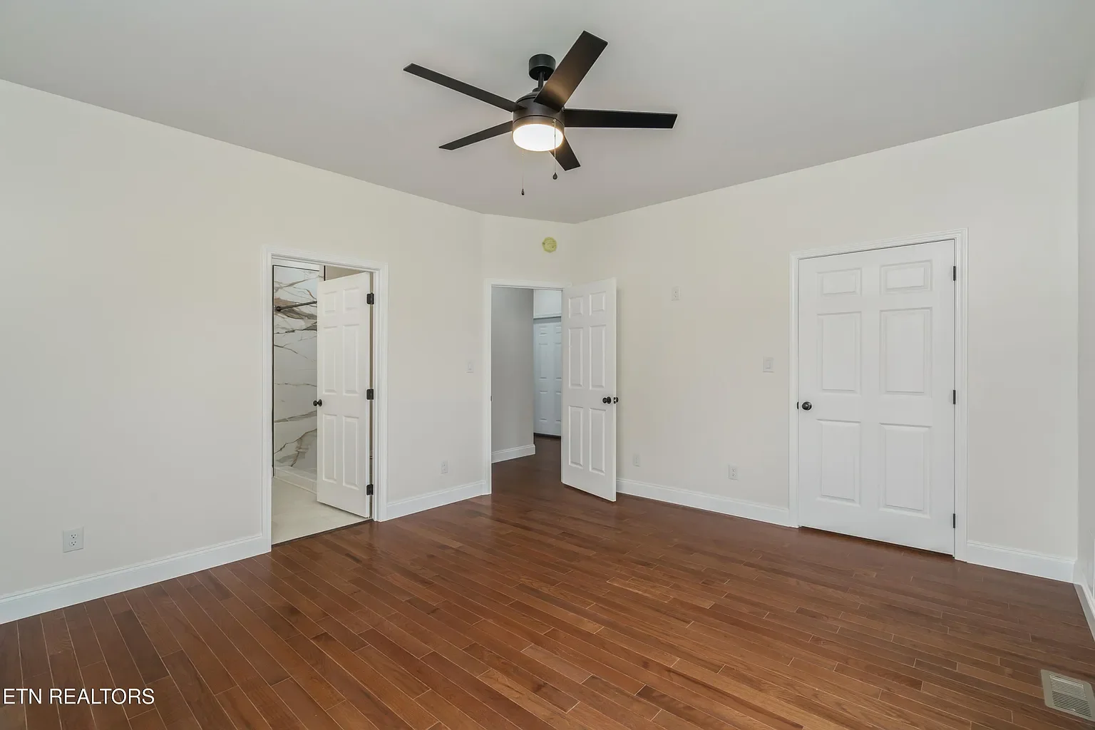 Installed hardwood, doors, trim. Painted all doors, trim, ceilings, and walls.