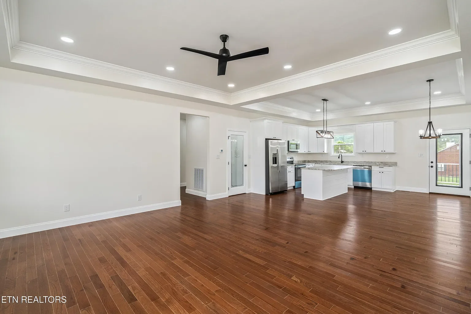Installed hardwood, doors, trim. Painted all doors, trim, ceilings, and walls.