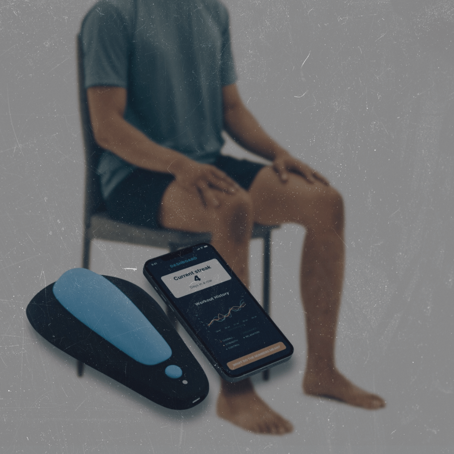 A man sitting on a chair with his hands on his knees, a fitness tracker and a smartphone with workout data on a table in front of him.