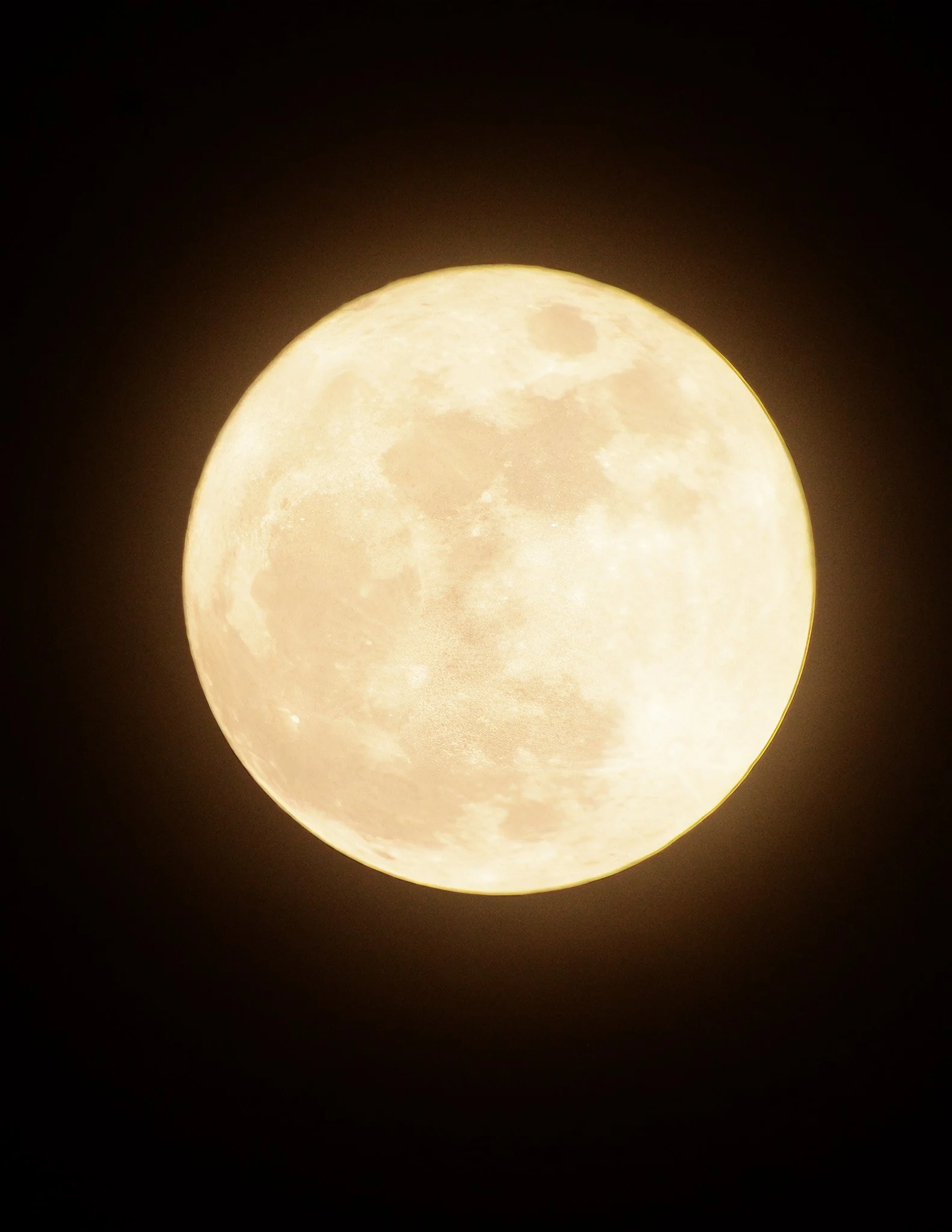 Super Full moon glowing against a dark night sky.