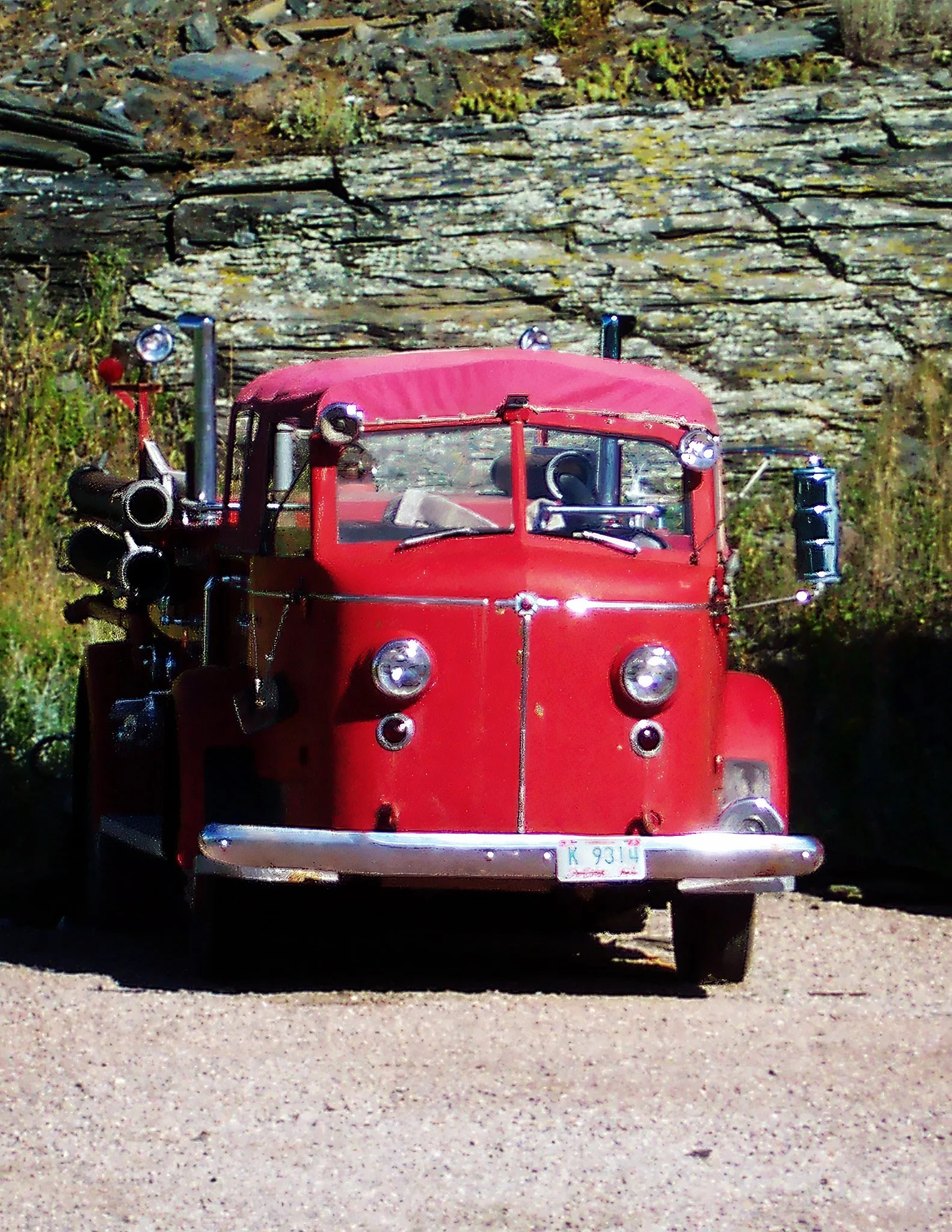 A vintage red fire truck American LaFrance 700 series.