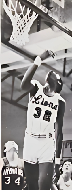 A female basketball player wearing jersey number 32, with