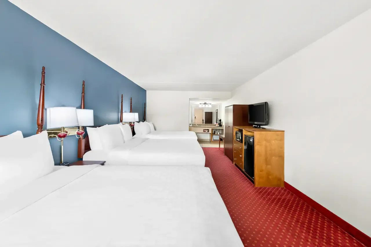 Spacious room with three Queen Beds and exterior corridors