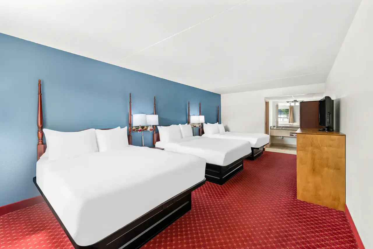 Spacious room with three Queen Beds and exterior corridors