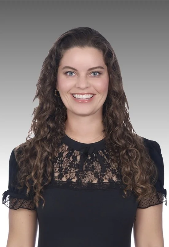 headshot of a woman, Ellen Kruk, Esq. smiling while wearing a dark professional dress