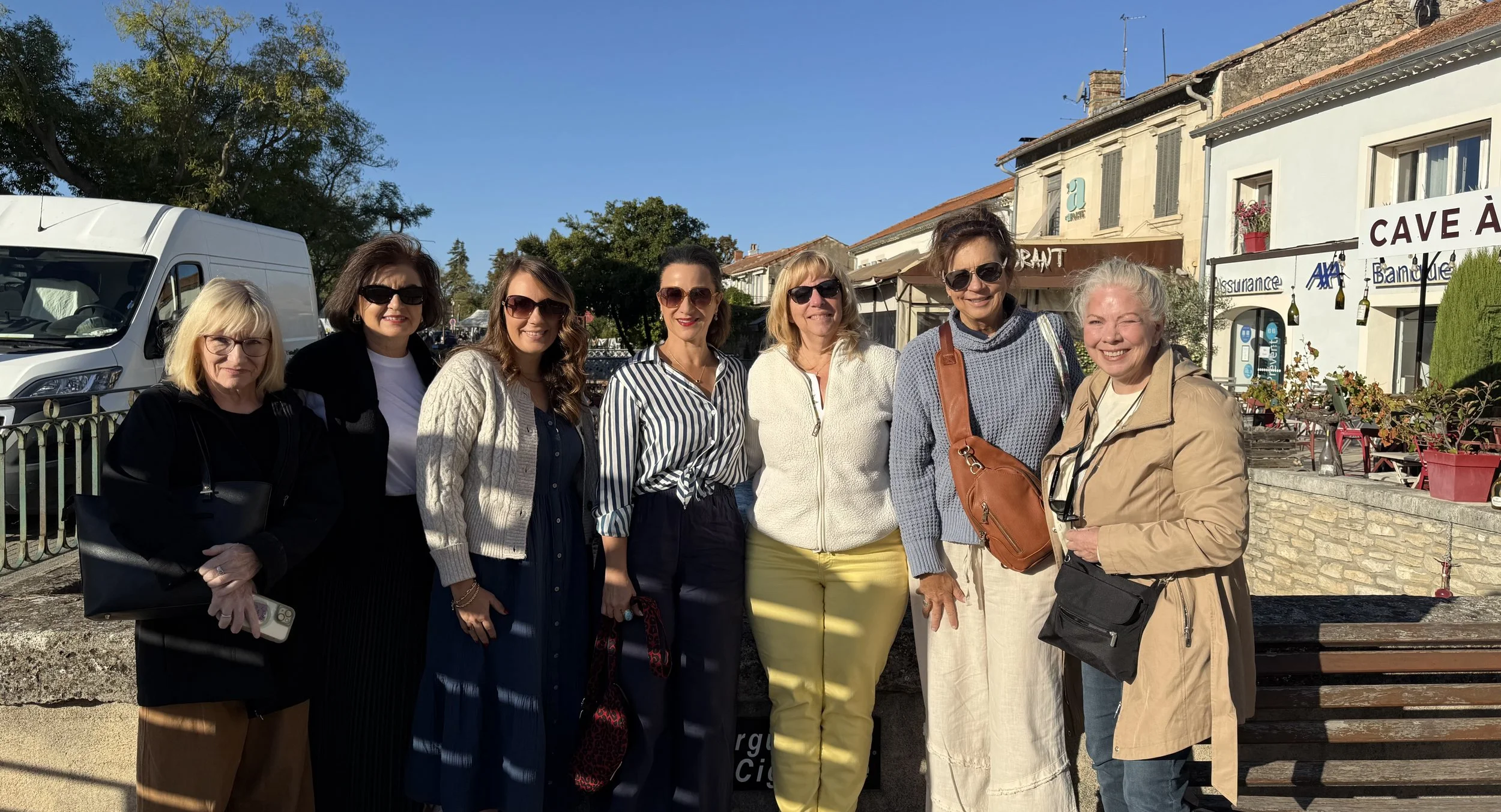 Small group women exploring a Paris market during a hosted women’s trip