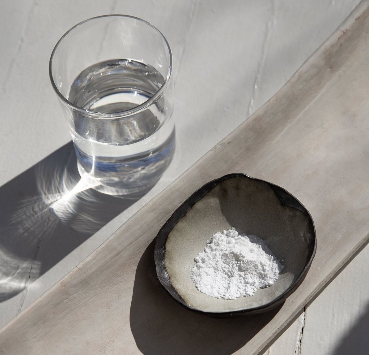 supplement powder and a glass of water